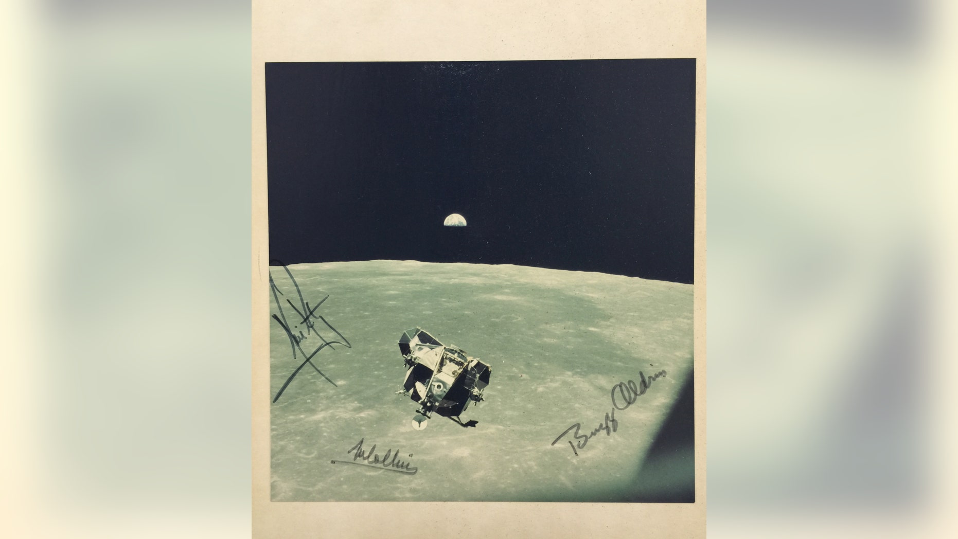 The signed moon landing photo (Henry Aldridge and Son).