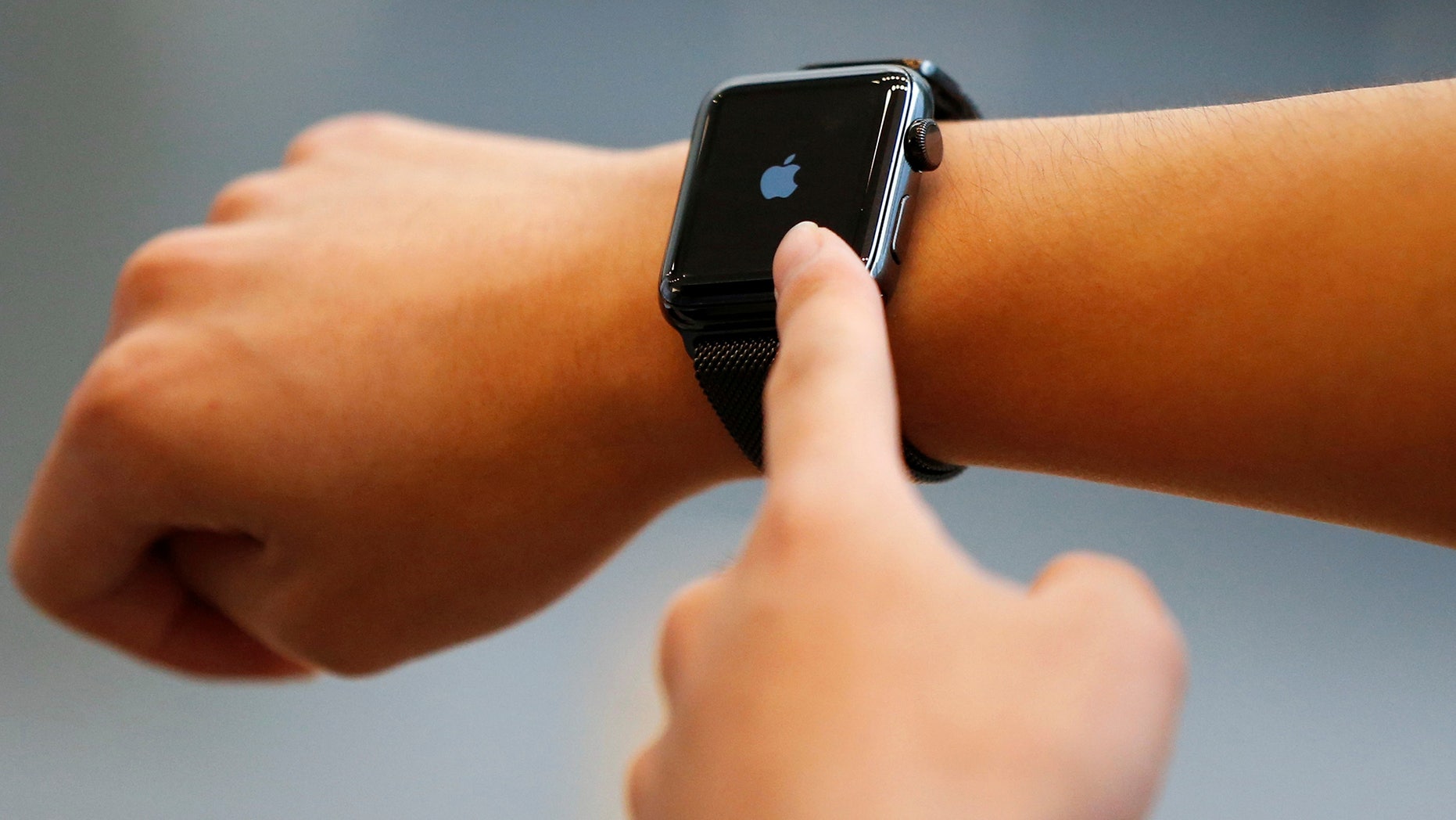 Daiki Shimizu tries an Apple Watch Series 2 after it went on sale at the Apple Store at Tokyo's Omotesando shopping district, Japan, September 16, 2016.