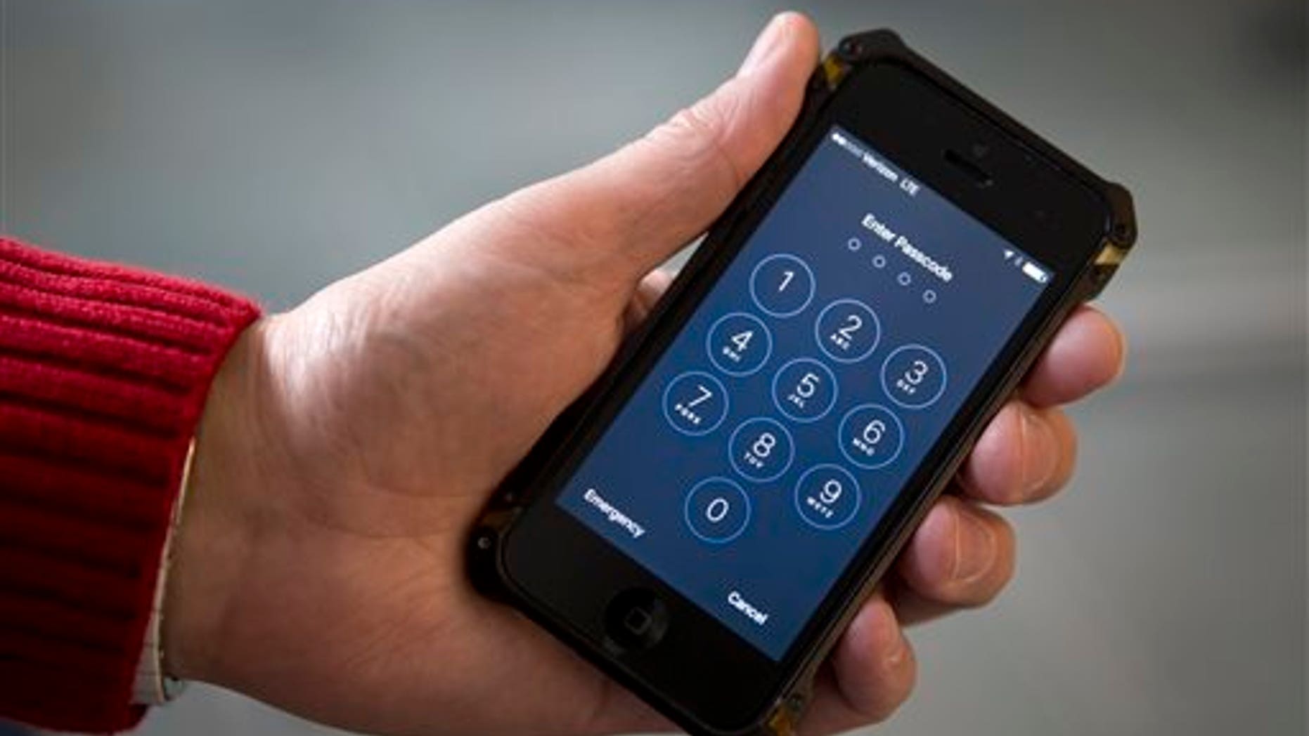 An iPhone is seen in Washington, Wednesday, Feb. 17, 2016. (AP Photo/Carolyn Kaster)