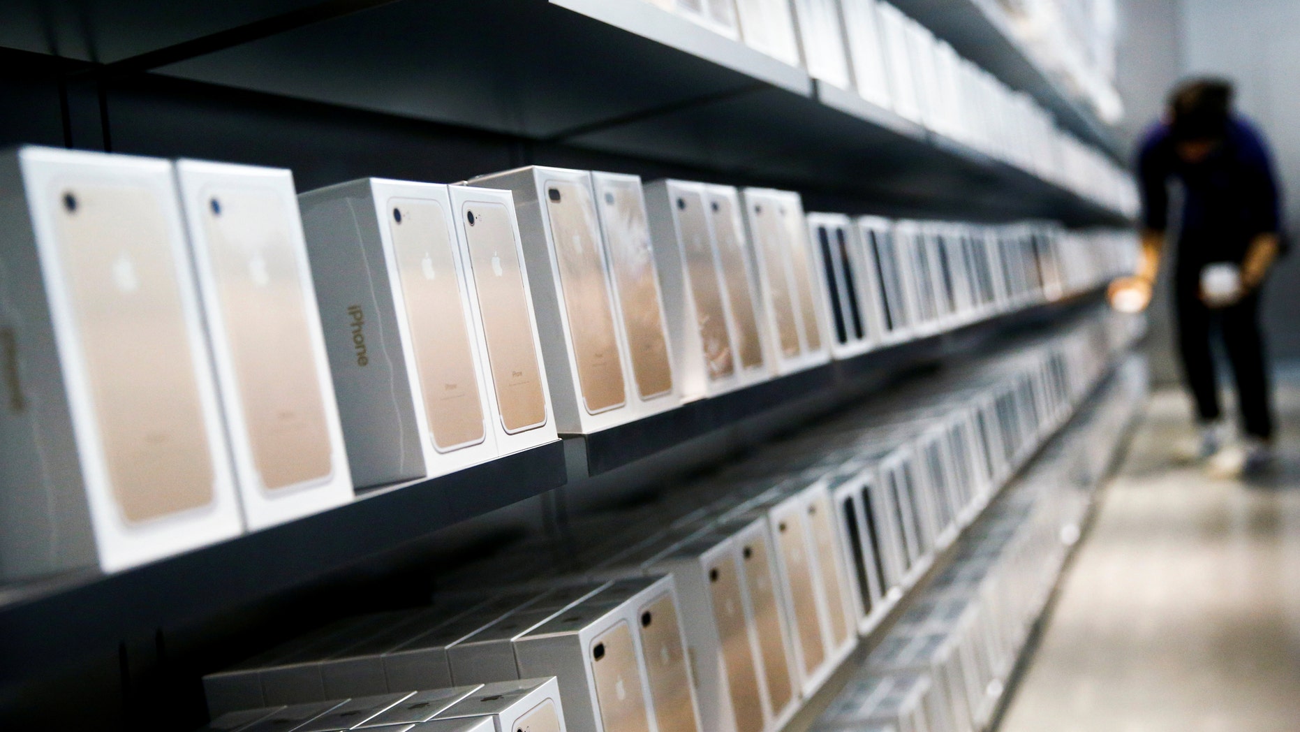 Apple's new iPhone 7 smartphones sit on a shelf at an Apple store in Beijing, China, Sept. 16, 2016. (REUTERS/Thomas Peter)
