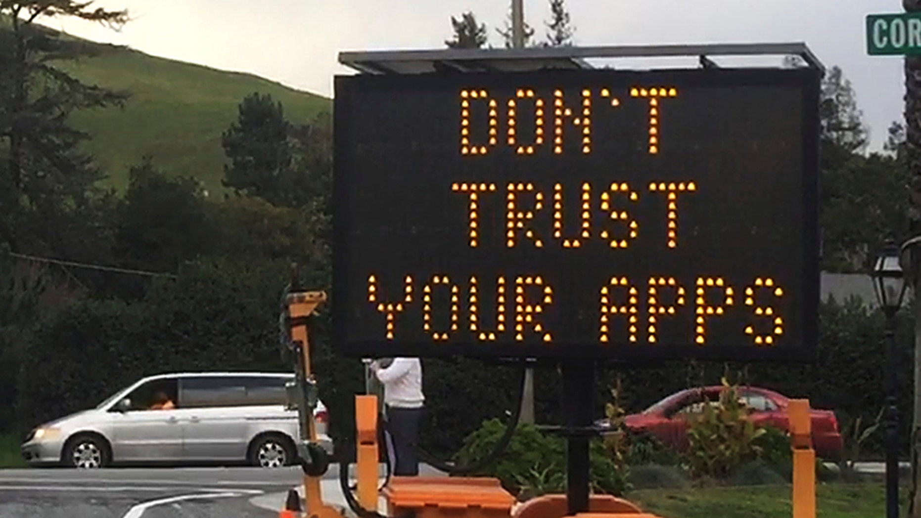 This undated photo provided by the City of Fremont, Calif., shows a blinking sign warning drivers: "Don't Trust Your Apps," in Fremont, Calif. The sign was part of the city's response to combatting the congestion caused by traffic being diverted onto neighborhood and side streets by digital maps that direct motorists away from highway traffic jams. (City of Fremont, Calif. via AP)