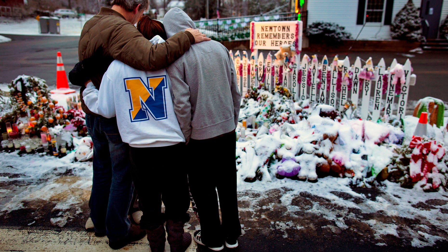 Members of the Newton community mourn those lost in the Sandy Hook Elementary School massacre.
