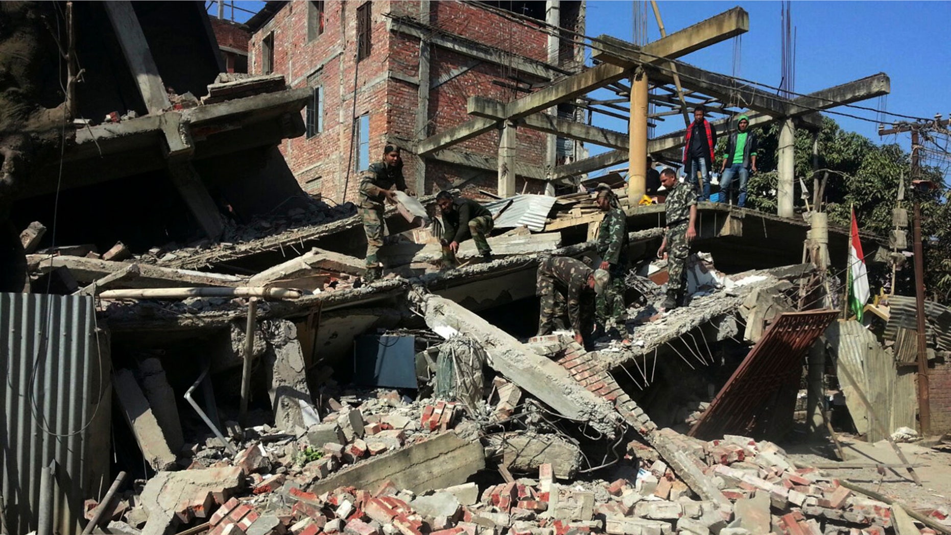 Jan. 4, 2016: Indian soldiers remove debris from a house that collapsed in an earthquake in Imphal, capital of the northeastern state of Manipur. (AP Photo/Worshon Ngashangva)