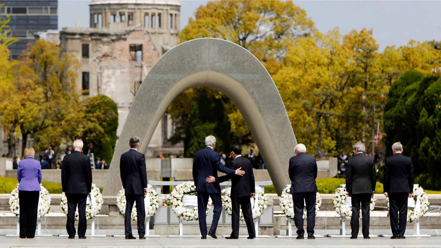 April 11, 2016: U.S. Secretary of State John Kerry, center left, puts his arm around Japan's Foreign Minister Fumio Kishida, center right, after they and fellow G7 foreign ministers laid wreaths at the cenotaph at Hiroshima Peace Memorial Park in Hiroshima, Japan.