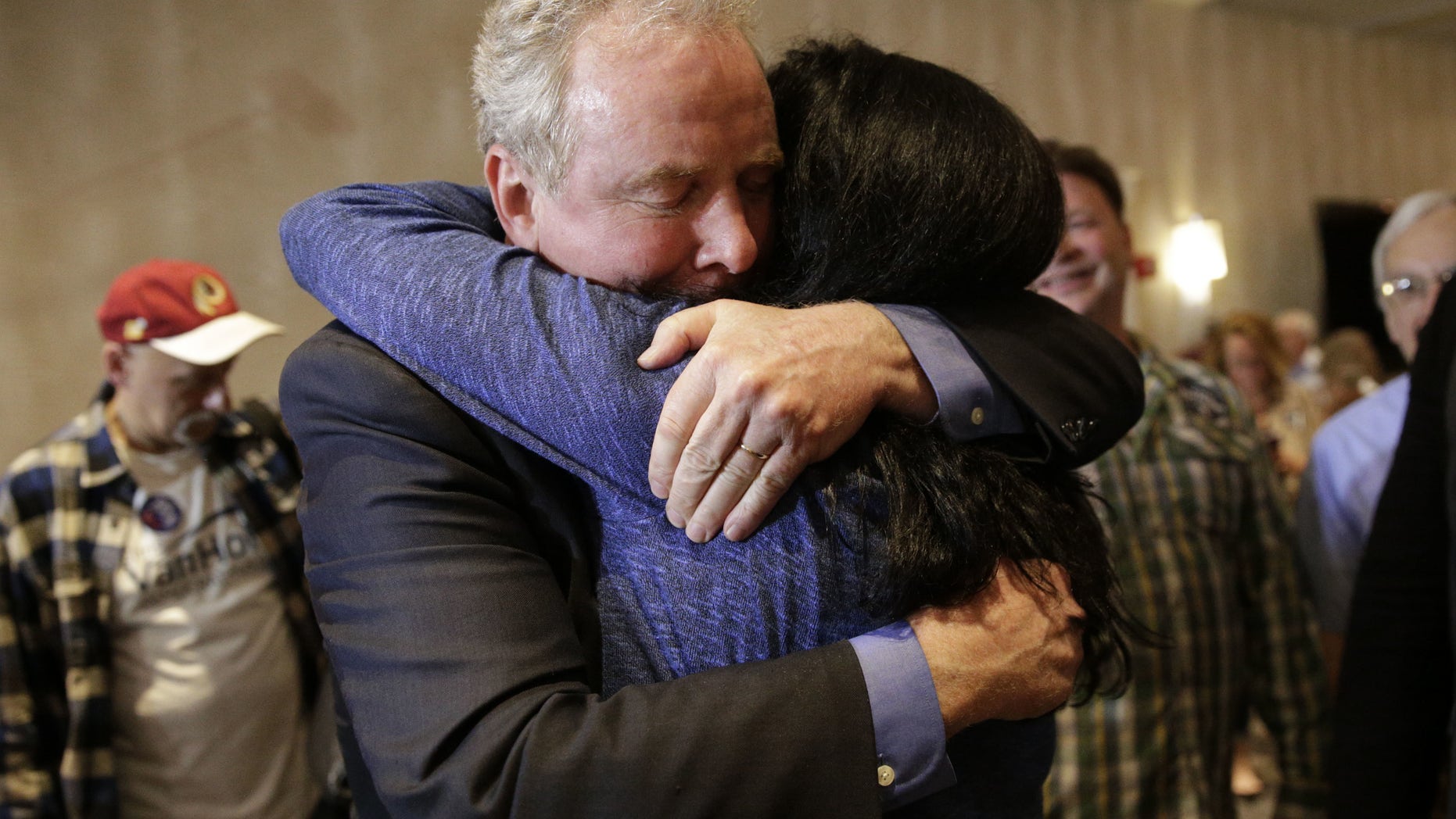 April 26, 2016: Democratic U.S. Senate candidate, Rep. Chris Van Hollen, D-Md., left, embraces supporter Carole Price after an election night party in Bethesda, Md.,