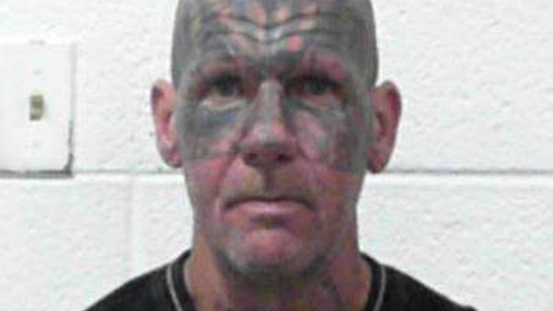 Ervin Franklin Harold, 51, allegedly held a woman against a wall and branded her multiple times, according to police.