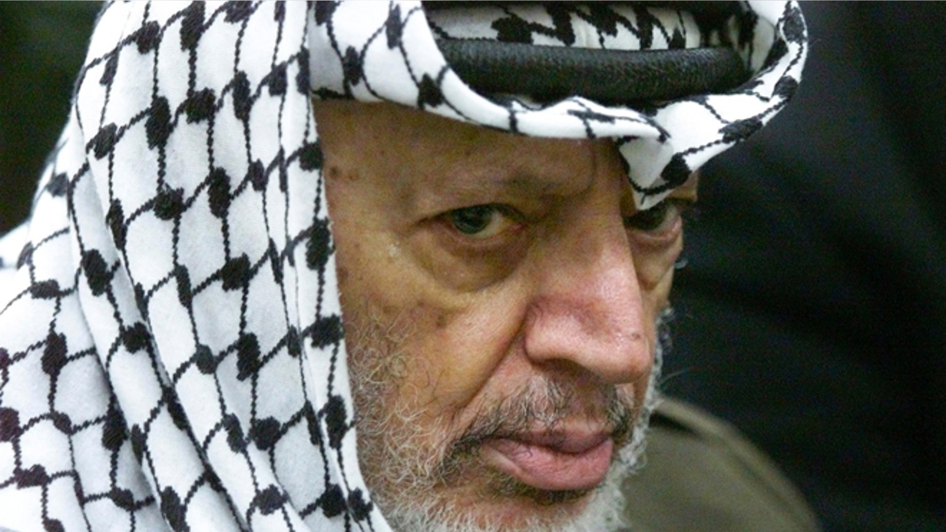May 31, 2002: This photo shows Palestinian leader Yasser Arafat pauses during the weekly Muslim Friday prayers in his headquarters in the West Bank city of Ramallah.