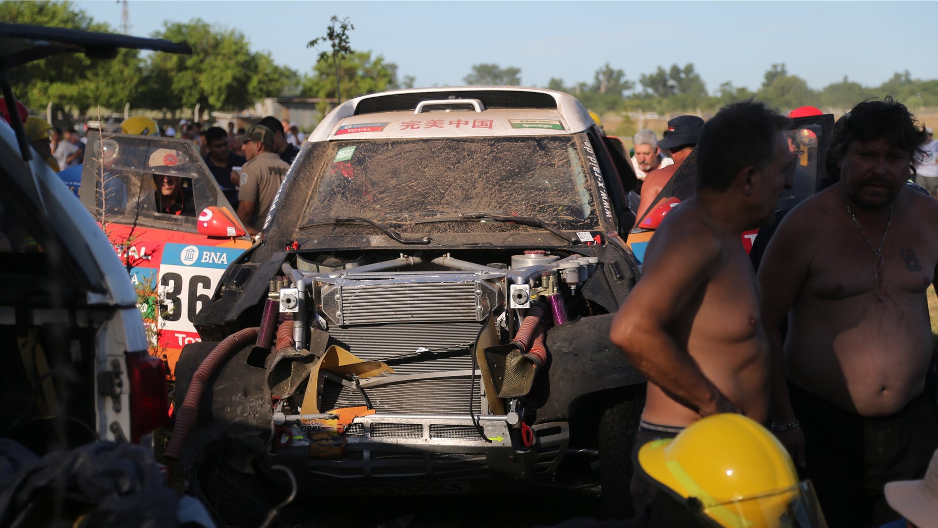China's Guo Meiling's, X-Raid Team's damaged Mini, is seen after an accident in which at least 8 spectators were injured, during the Buenos Aires-Rosario prologue stage of the Dakar Rally 2016, in Arrecifes, Argentina, Saturday, Jan. 2, 2016. Guo Meiling is the first Chinese female driver to participate in the rally. (AP Photo/Jorge Saenz)