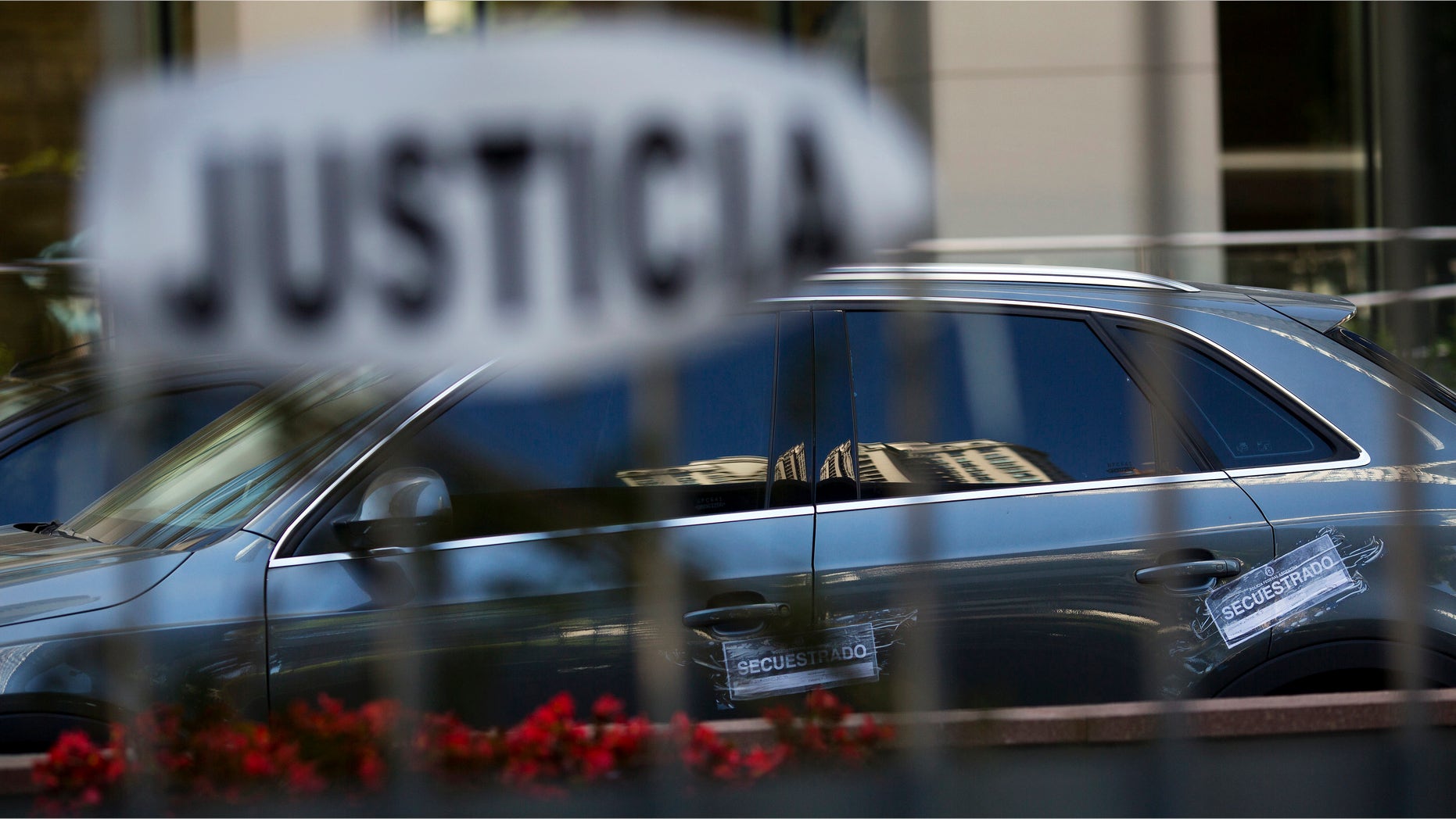Vehicle impoundment notices are taped to the car of the late prosecutor Alberto Nisman, parked at Le Parc Tower, where Nisman lived on the 13th floor of the luxury condo, in Buenos Aires, Argentina, Thursday, Jan. 22, 2015. Argentine President Cristina Fernandez made an about-face Thursday, saying she now is âconvincedâ that Nismanâs death was not a suicide just days after she suggested the man who accused her of a cover-up in the nationâs worst terrorist attack had killed himself. (AP Photo/Rodrigo Abd)