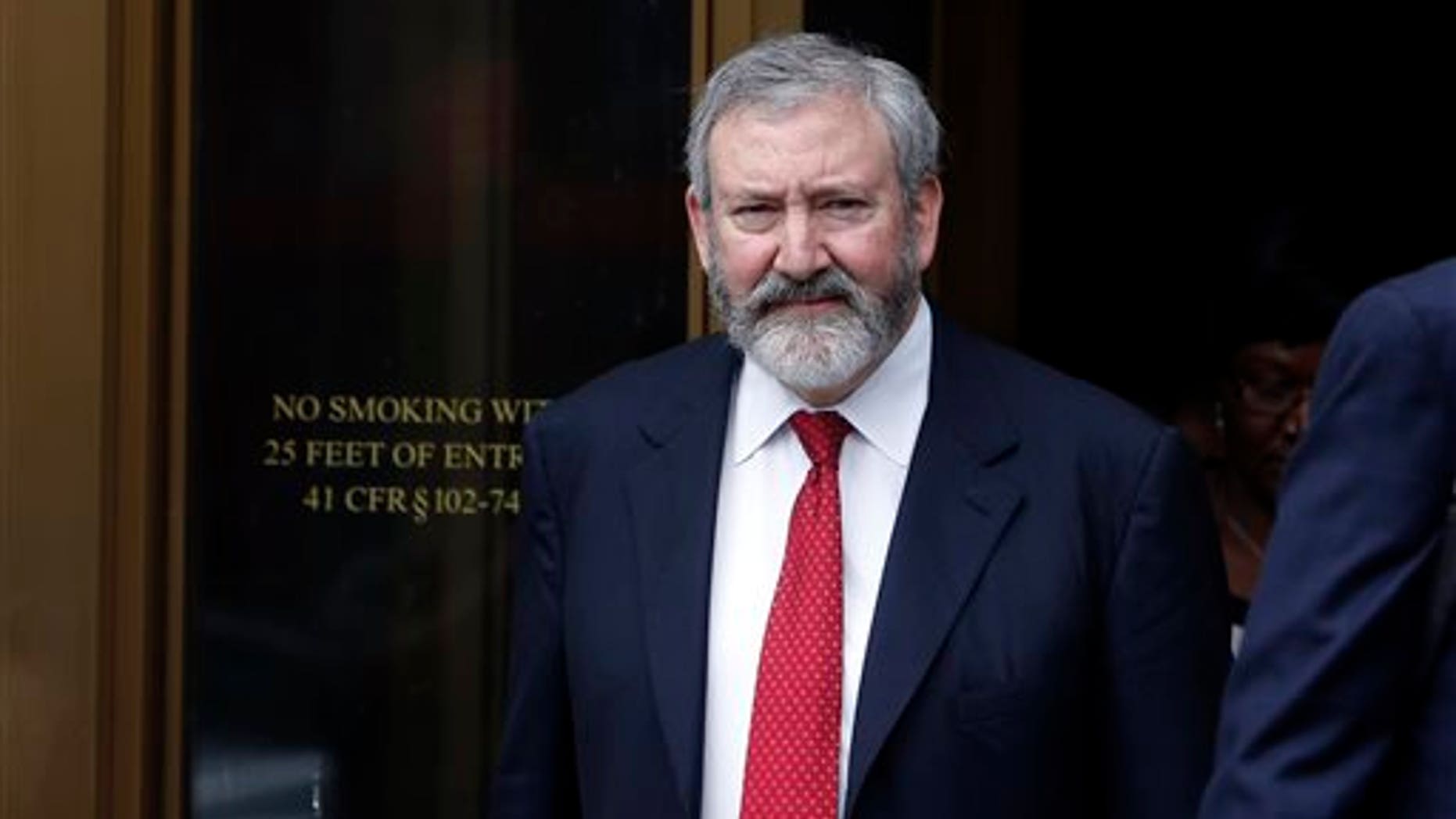 Jonathan Blackman, a lawyer representing Argentina, leaves federal court after a hearing regarding the country's request to extend deadlines to repay a $1.65 billion debt to U.S. hedge funds, Friday, June 27, 2014, in New York. Judge Thomas P. Griesa has ordered a U.S. bank to return a $539 million payment from Argentina, saying it was illegal to make. The order by the judge came Friday, three days before Argentina faces default if it fails to pay $832 million to the majority of its debt holders.