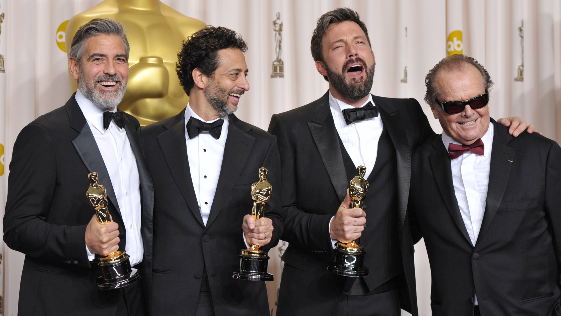 George Clooney, from left, Grant Heslov, Ben Affleck pose with their award for best picture for "Argo" pose with presenter Jack Nicholson, right, during the Oscars at the Dolby Theatre on Sunday Feb. 24, 2013, in Los Angeles. (Photo by John Shearer/Invision/AP)