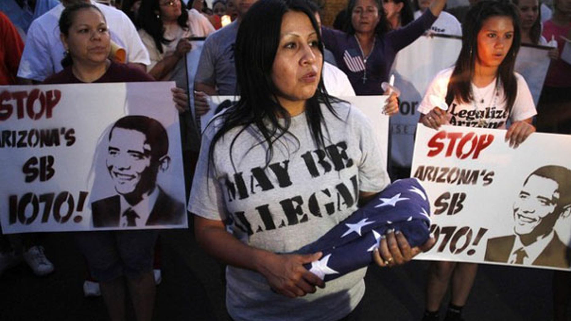 Demonstrators march to Arizona's State Capitol to protest the state's immigration law in Phoenix May 5. (Reuters Photo)