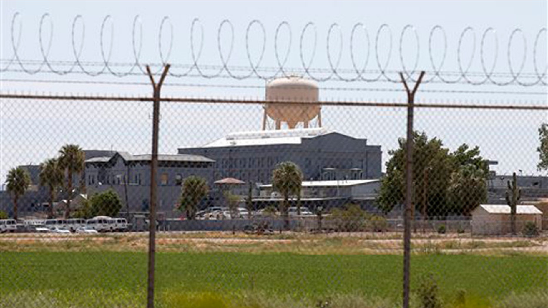 In this file photo a fence surrounds the state prison in Florence, Ariz.