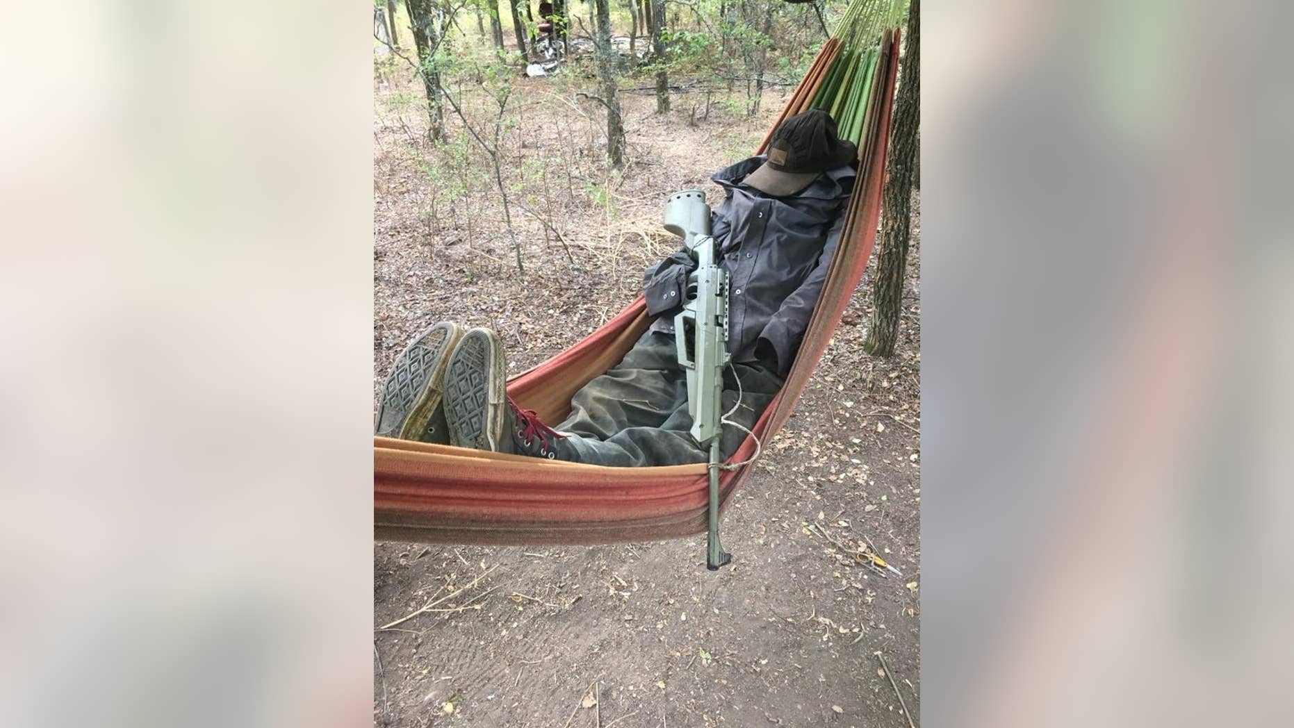 Police were reportedly undeterred by an armed scarecrow while searching an illegal marijuana field in Navarro County, Texas.