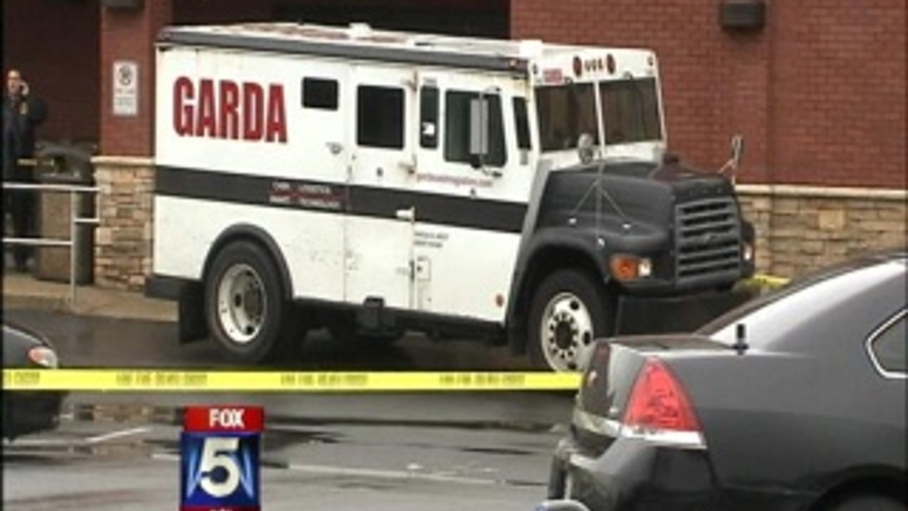 Authorities say an armored car worker who had just made a pickup at a Georgia grocery store was shot several times and robbed as he left the store.