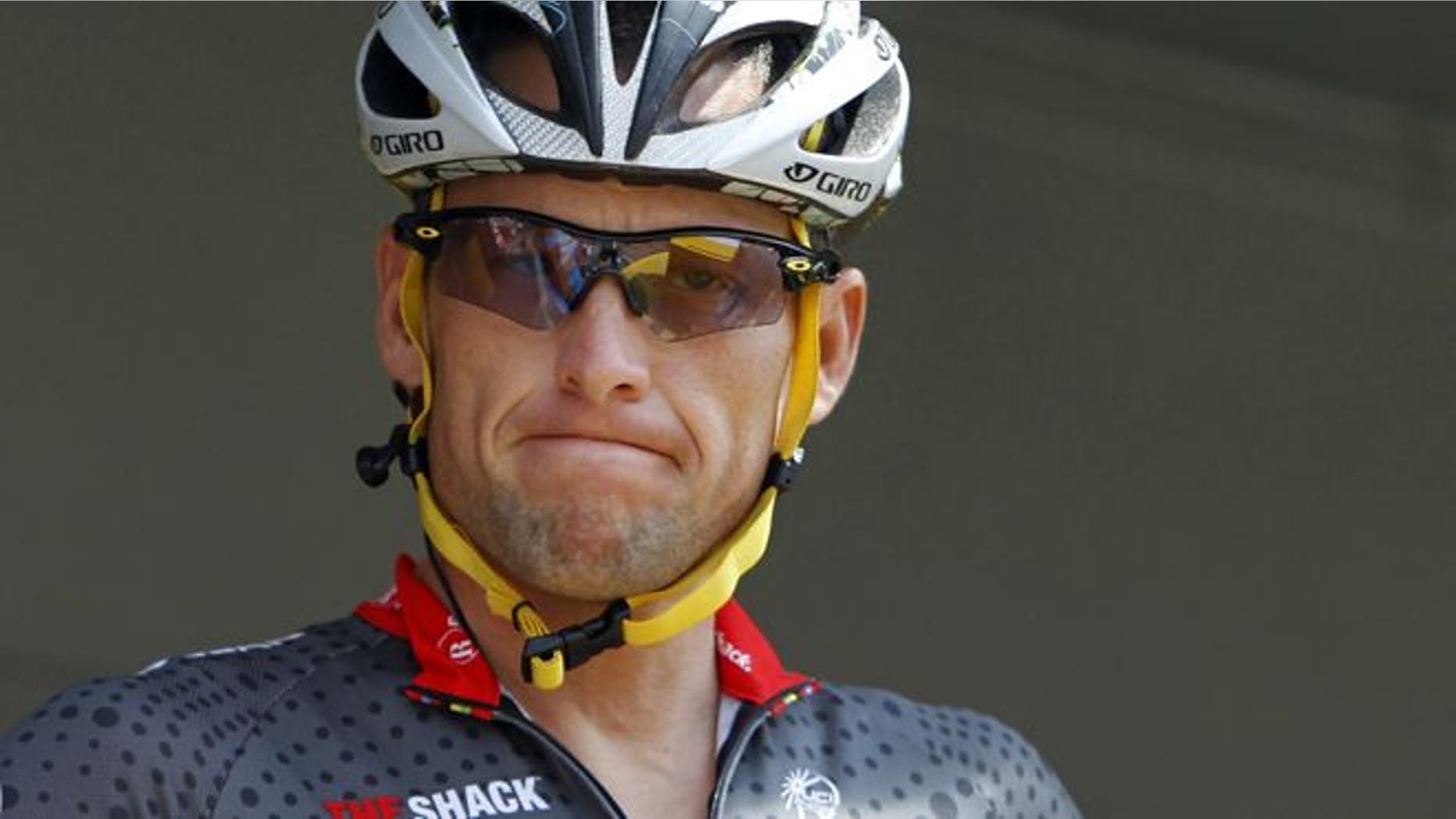 July 6, 2010: Lance Armstrong grimaces prior to the start of the third stage of the Tour de France cycling race in Wanze, Belgium.