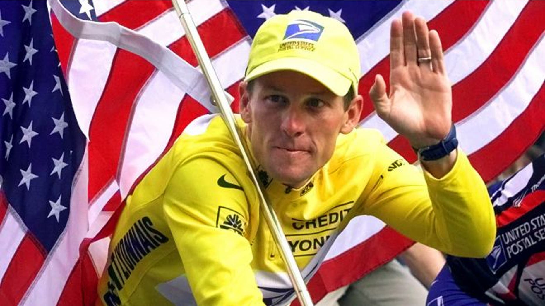 July 23, 2000: Lance Armstrong rides down the Champs Elysees after the final stage of the Tour de France cycling race in Paris.