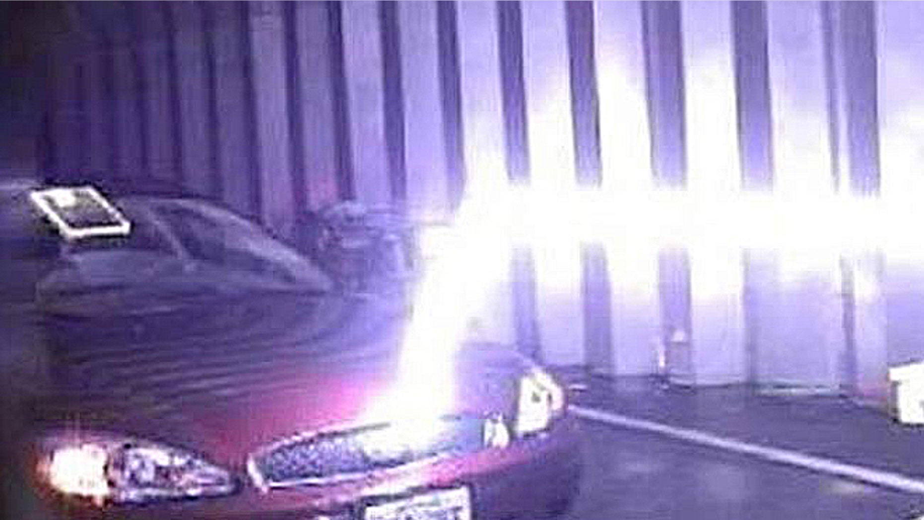 A guided lightning bolt travels horizontally, then hits a car when it finds the lower resistance path to ground in a U.S. Army test.