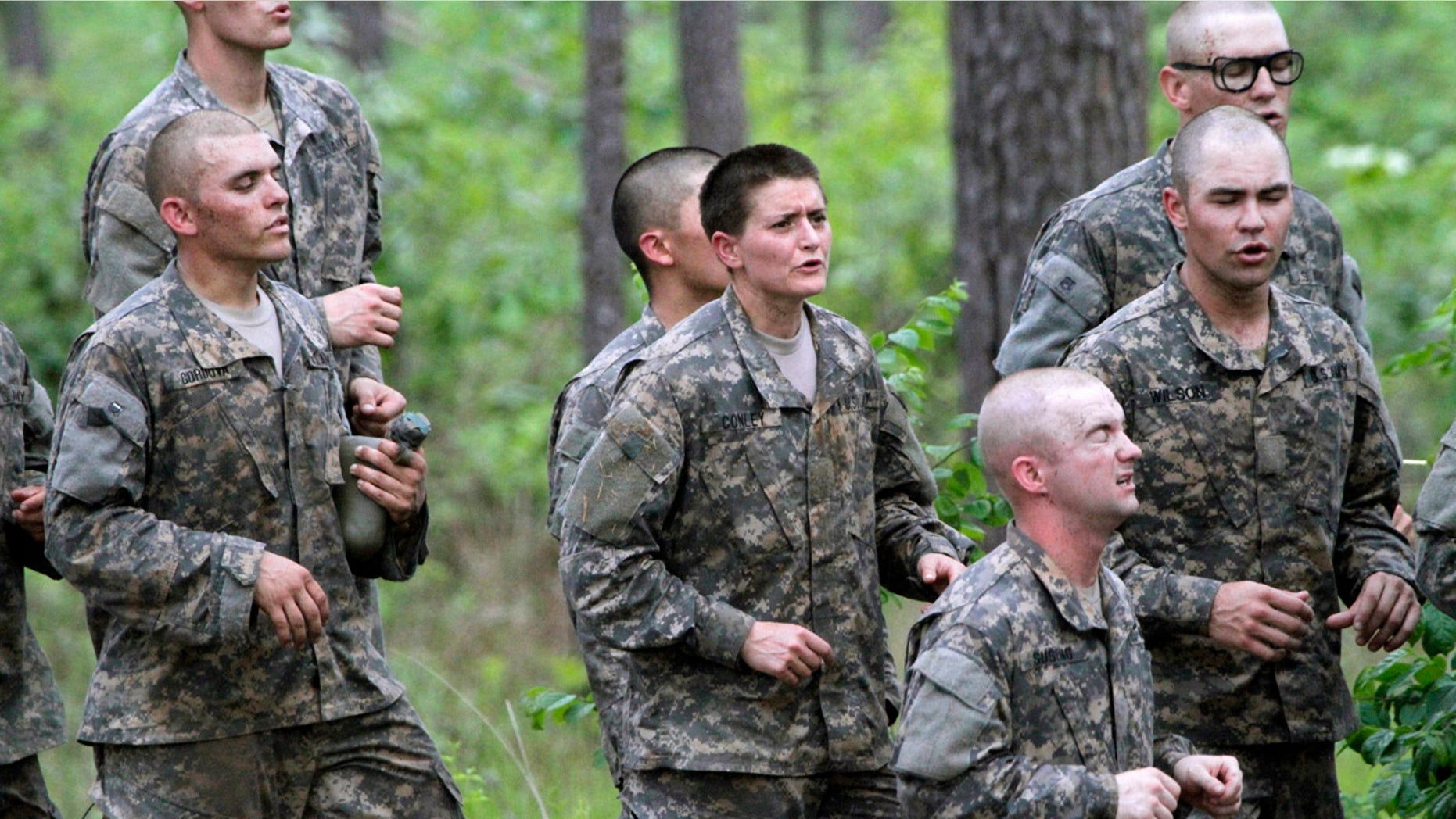 April 19, 2015: One of 20 female soldiers, center, among the 400 students who qualified to start Ranger School runs in place in between obstacles on the Darby Queen, one of the toughest obstacle courses in U.S. Army training, at Fort Benning, Ga. (Robin Trimarchi/Ledger-Enquirer via AP, File)