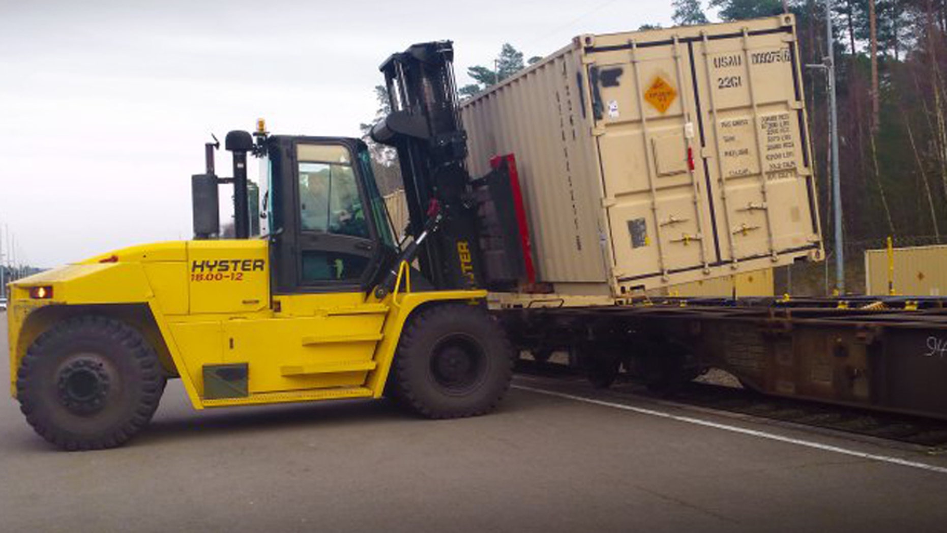 Werner Staab, a heavy equipment operator with the Theater Logistics Support Center-Europe's ammunition center, uses a forklift to offload cargo containers full of ammunition from a train at Miesau Depot in Germany.