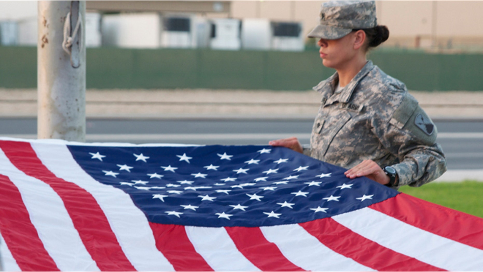 A Soldier on flag detail prepares to fold Old Glory. (U.S. Army/Sgt. John Carkeet IV)