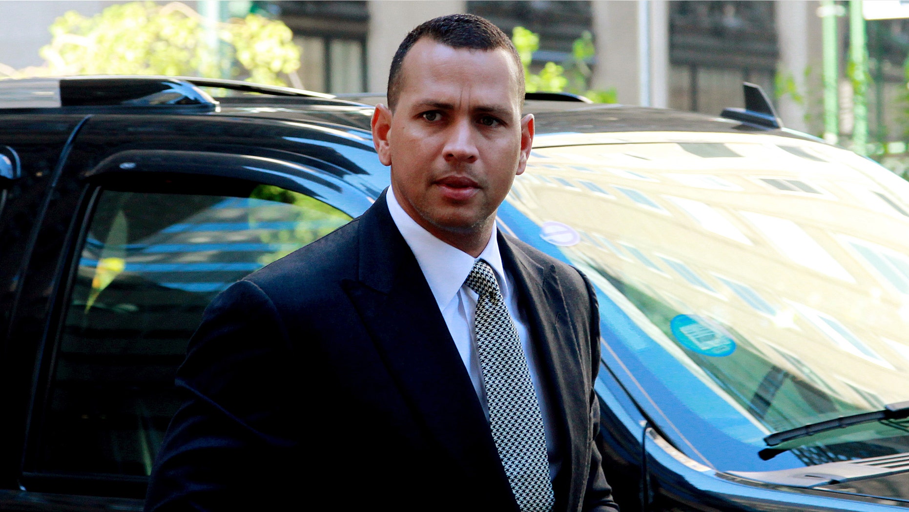 This Oct. 1, 2013 photo shows New York Yankees' Alex Rodriguez arriving at the offices of MLB in New York.