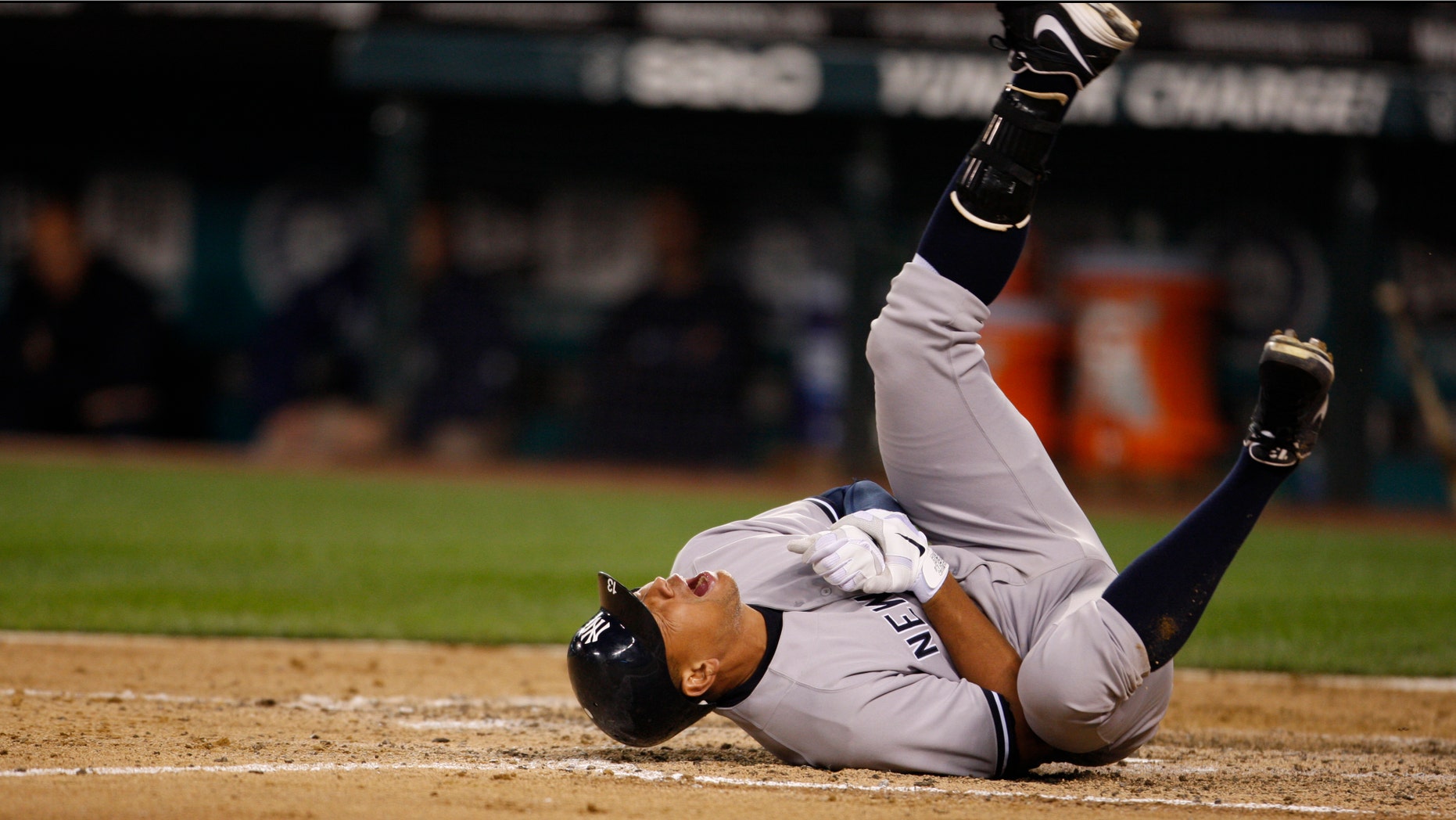 July 24: New York Yankees' Alex Rodriguez rolls on the ground after being hit by a pitch in the eighth inning of a baseball game against the Seattle Marinersin Seattle.