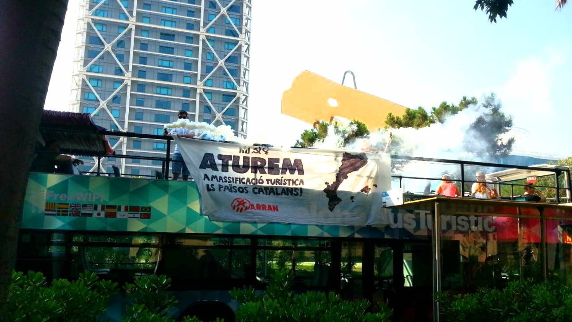 The group, called Arran, protested mass tourism and overcrowding by boarding buses in Barcelona, Valencia and Palma.