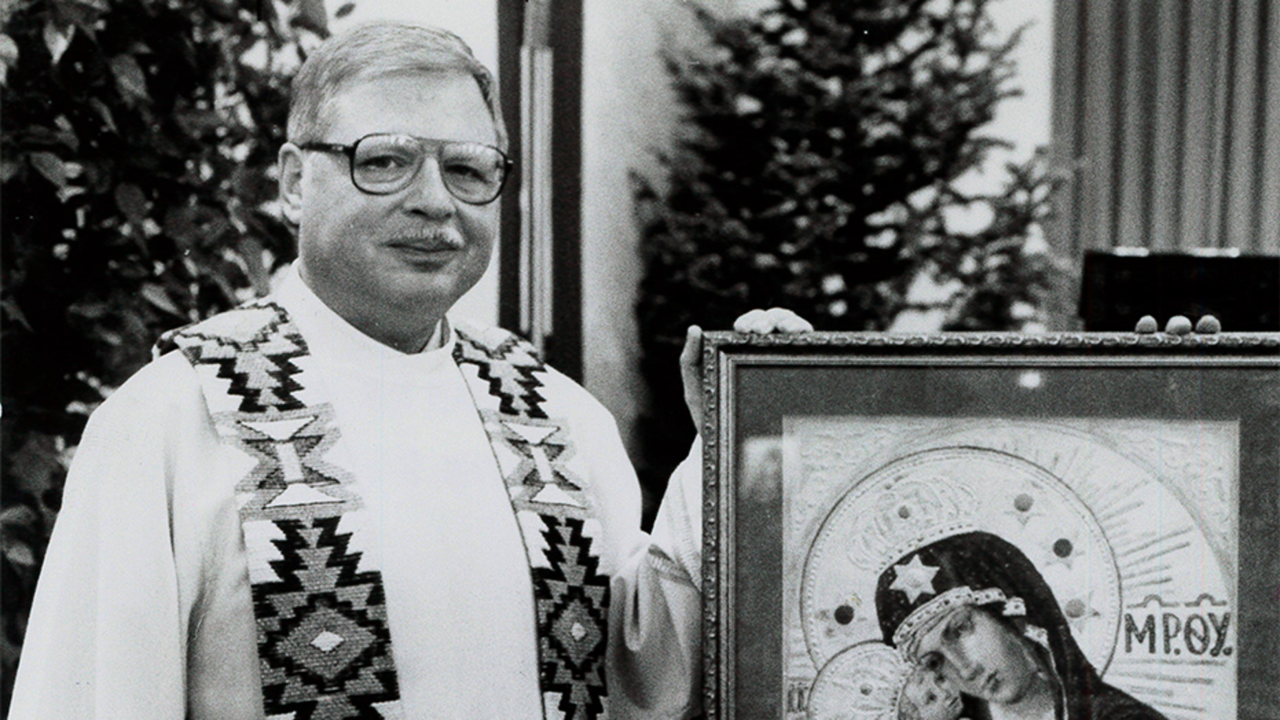 This 1989 file photo shows Father Arthur Perrault in Albuquerque, N.M.