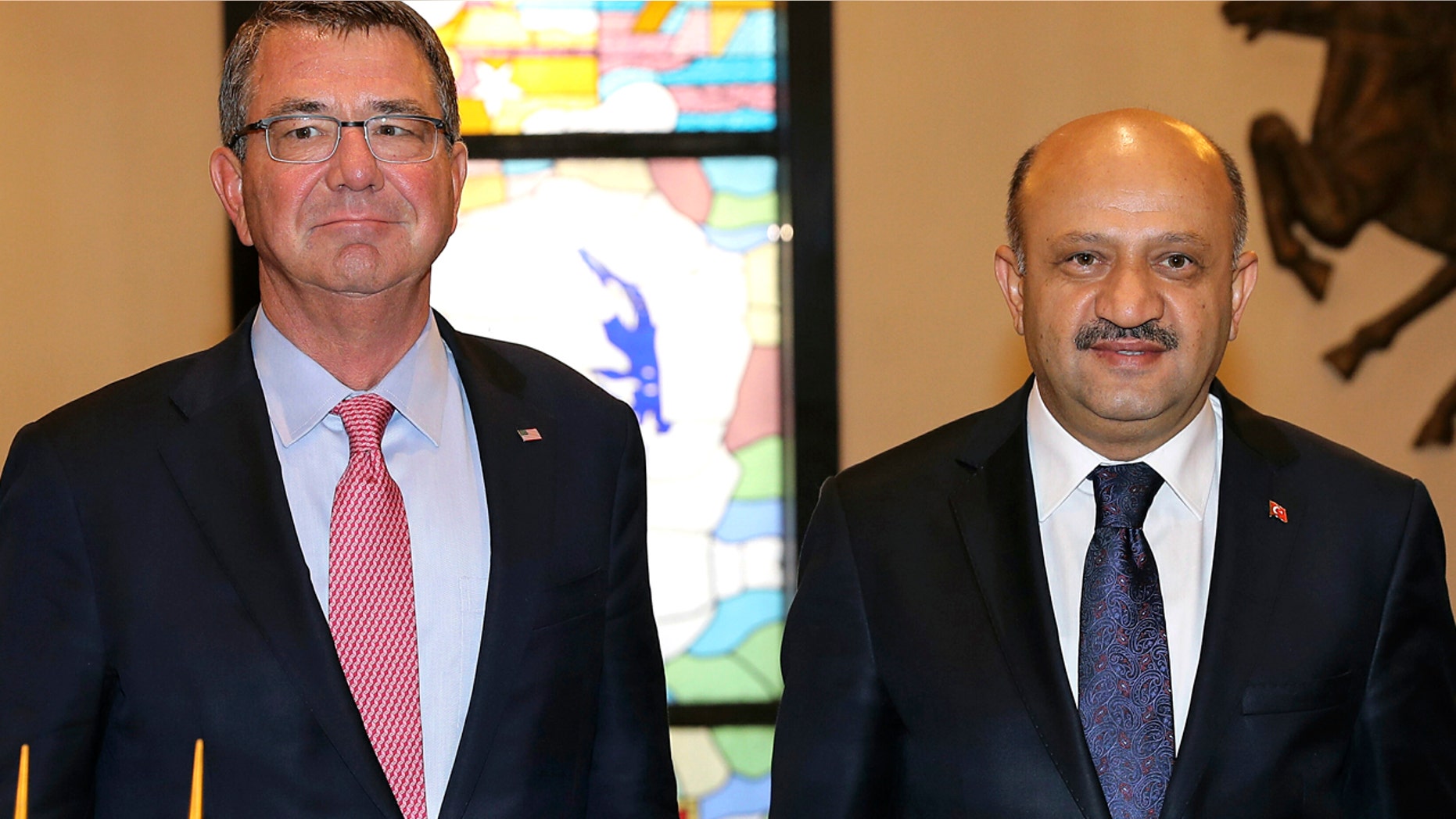 Oct. 21, 2016: U.S Secretary of Defense Ash Carter, left, and his Turkish counterpart Fikri Isik pose for a photo before a meeting at the Defense Ministry in Ankara