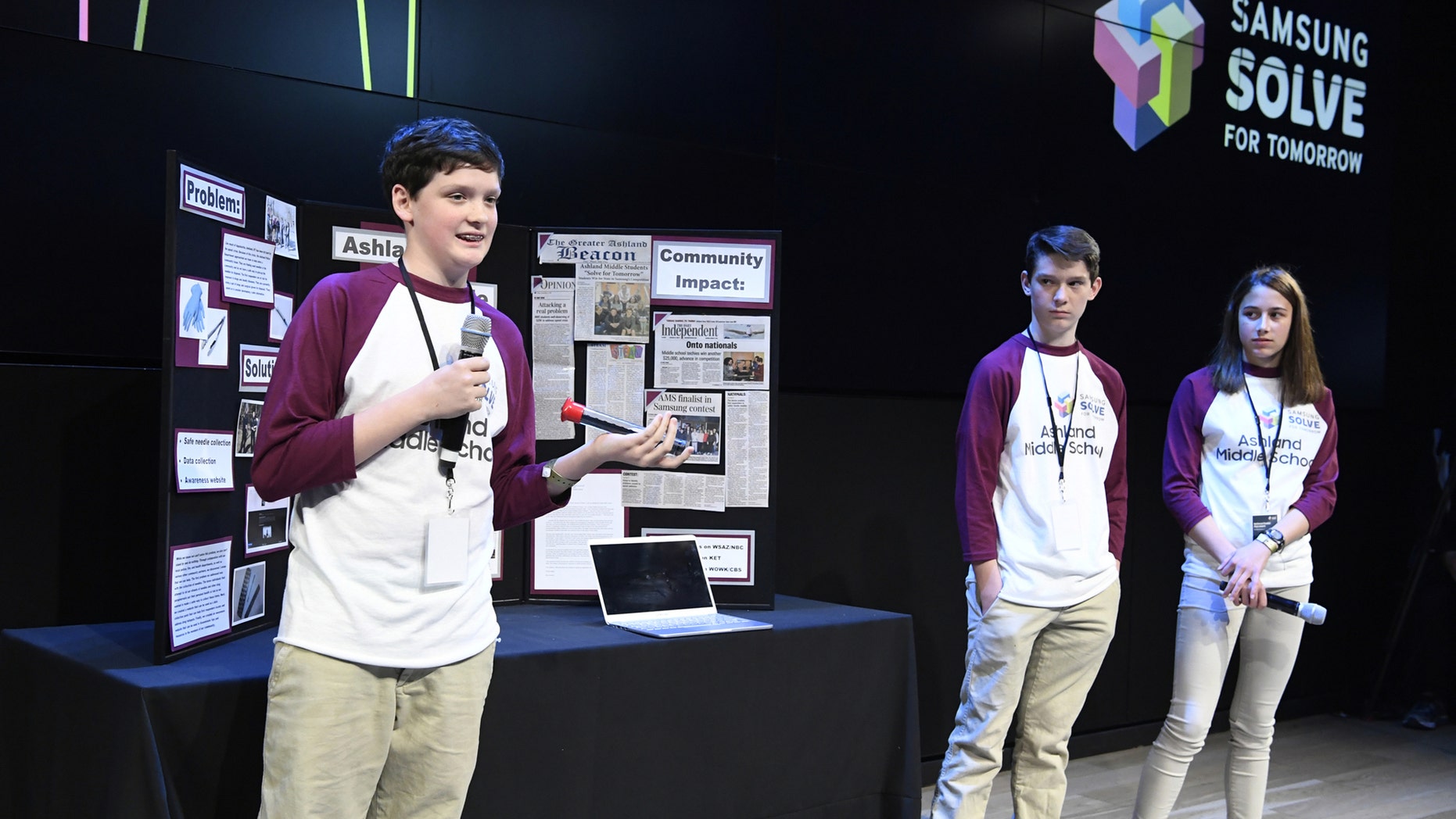Students (left to right) Isaac Campbell, Caleb Campbell and Aubree Hay from Ashland Middle School in Ashland, KY present their STEAM project to a panel of judges at the Samsung Solve for Tomorrow national finalist pitch event on Monday, April 9, 2018 in New York City. The students created a device that allows first responders to safely collect hazardous hypodermic needles (Samsung)