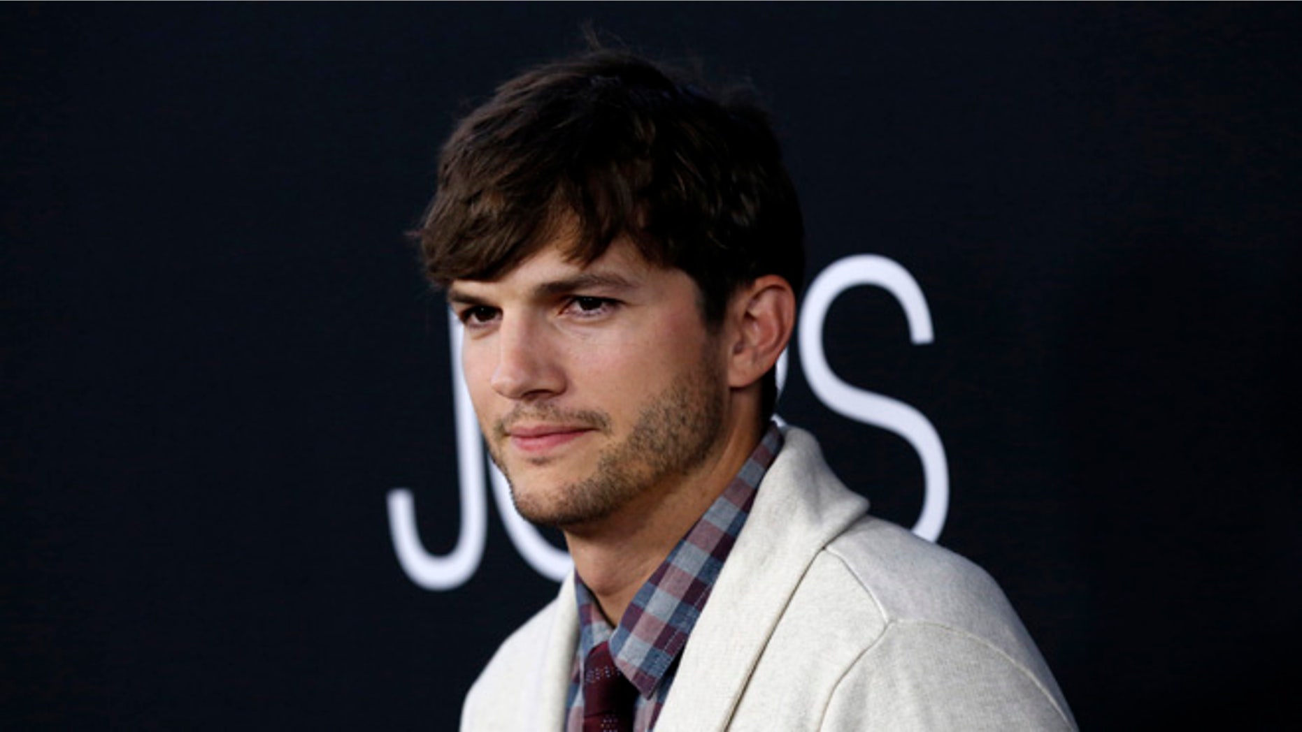 Ashton Kutcher handled a protester at a Airbnb in Los Angeles.