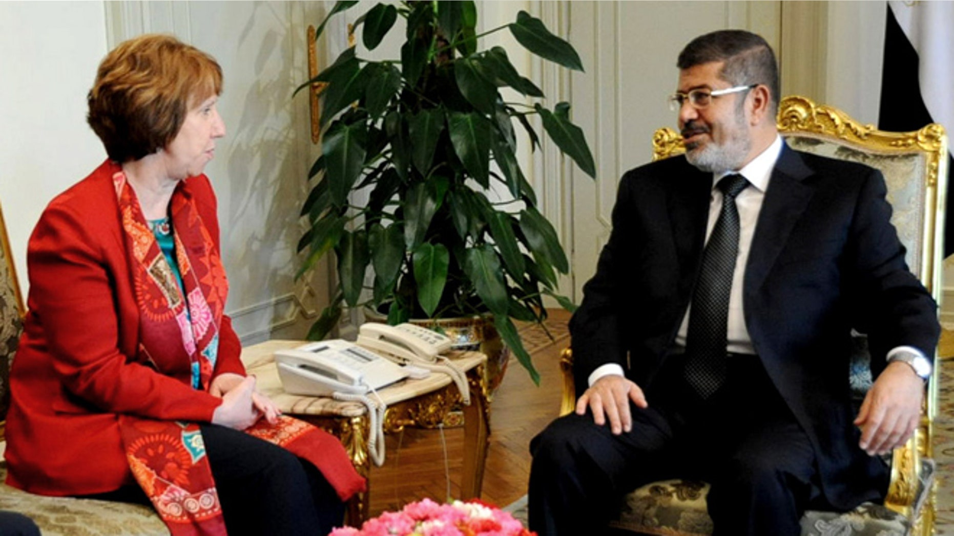 June 19, 2013: In this file image released by the Egyptian Presidency, Egyptian President Mohammed Morsi, right, meets with High Representative of the European Union for Foreign Affairs Catherine Ashton, at the Presidential Palace in Cairo, Egypt. Ashton held a two-hour meeting with Morsi, the EU said on Tuesday, July 29, 2013, in the Islamist leader's first meeting with an outsider since the military deposed him nearly a month ago.
