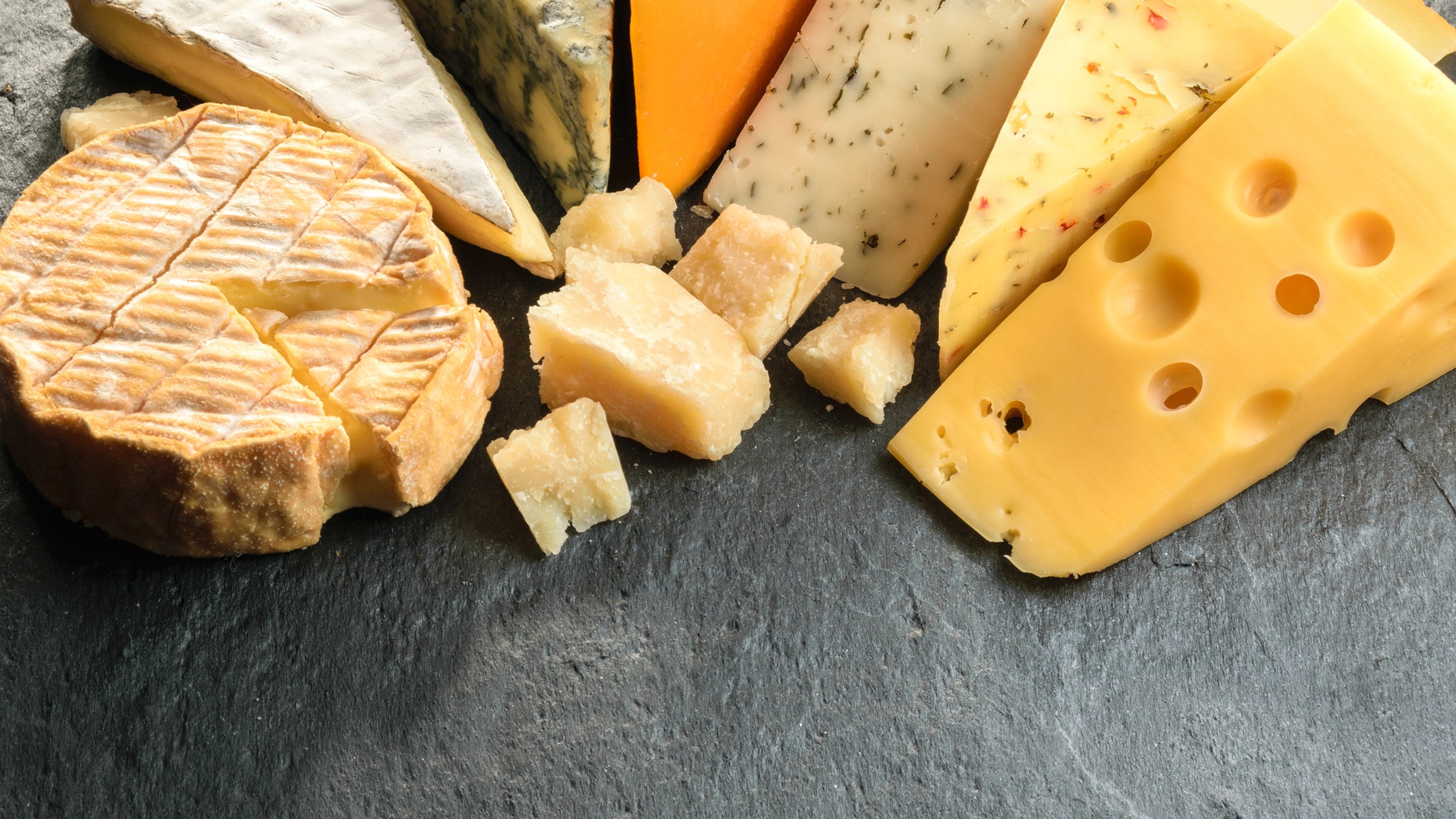 Various types of cheese with empty space background