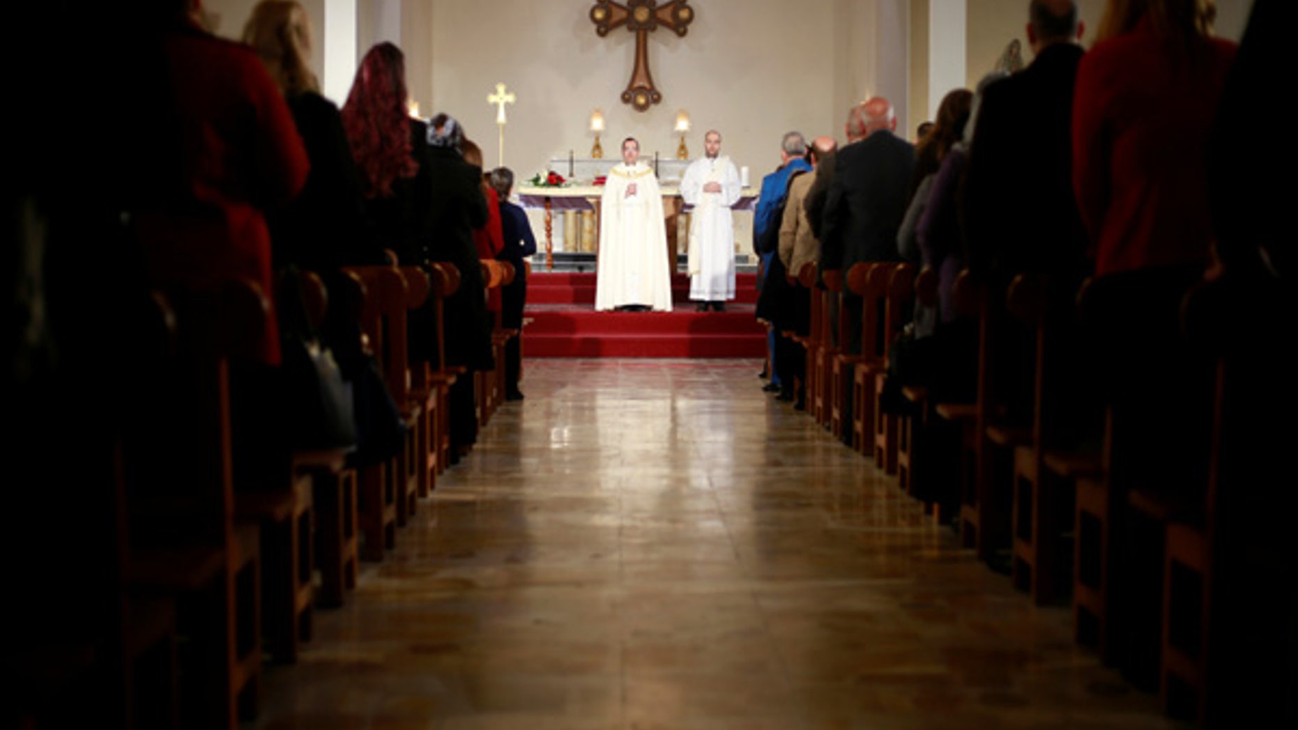 Iraqi Christians attend a mass on Christmas at St. Joseph Chaldean church in Baghdad, Iraq, Dec. 25, 2016.