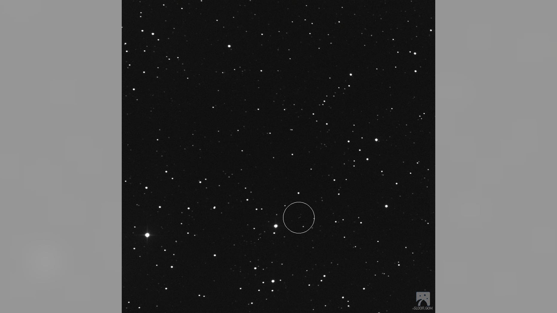 The asteroid 2017 BX is seen in this image (in circle) ahead of its close Earth flyby on Jan. 24, 2017. The asteroid passed by at a distance of 162,252 miles - about 30 percent closer than distance between the Earth and moon. (Slooh.com)