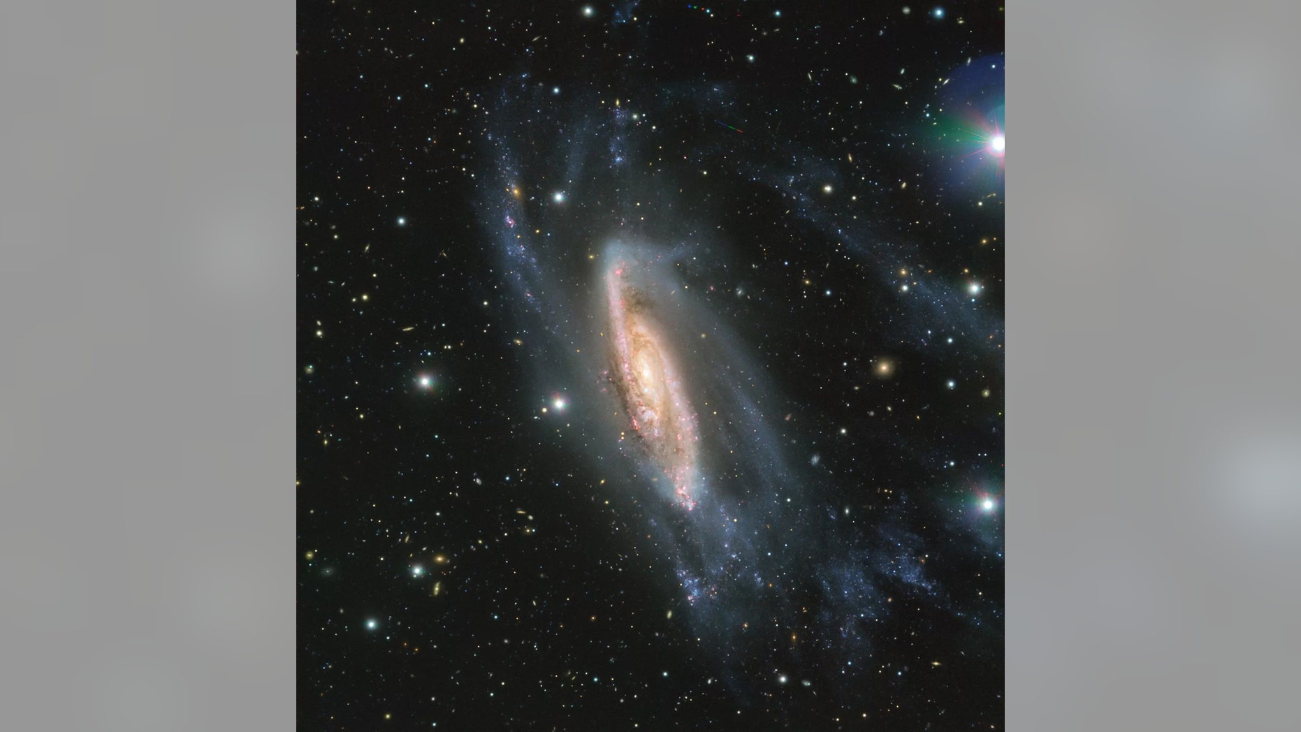 The European Southern Observatory's (ESO) Very Large Telescope in Chile captured this view of the spiral galaxy NGC 3981 in May 2018. The image was taken using the ESO's FORS2 instrument, as part of the Cosmic Gems program, which photographs the southern skies when conditions aren't good for scientific observations. An asteroid's trail can also be seen near the top, slightly right of center. Credit: ESO