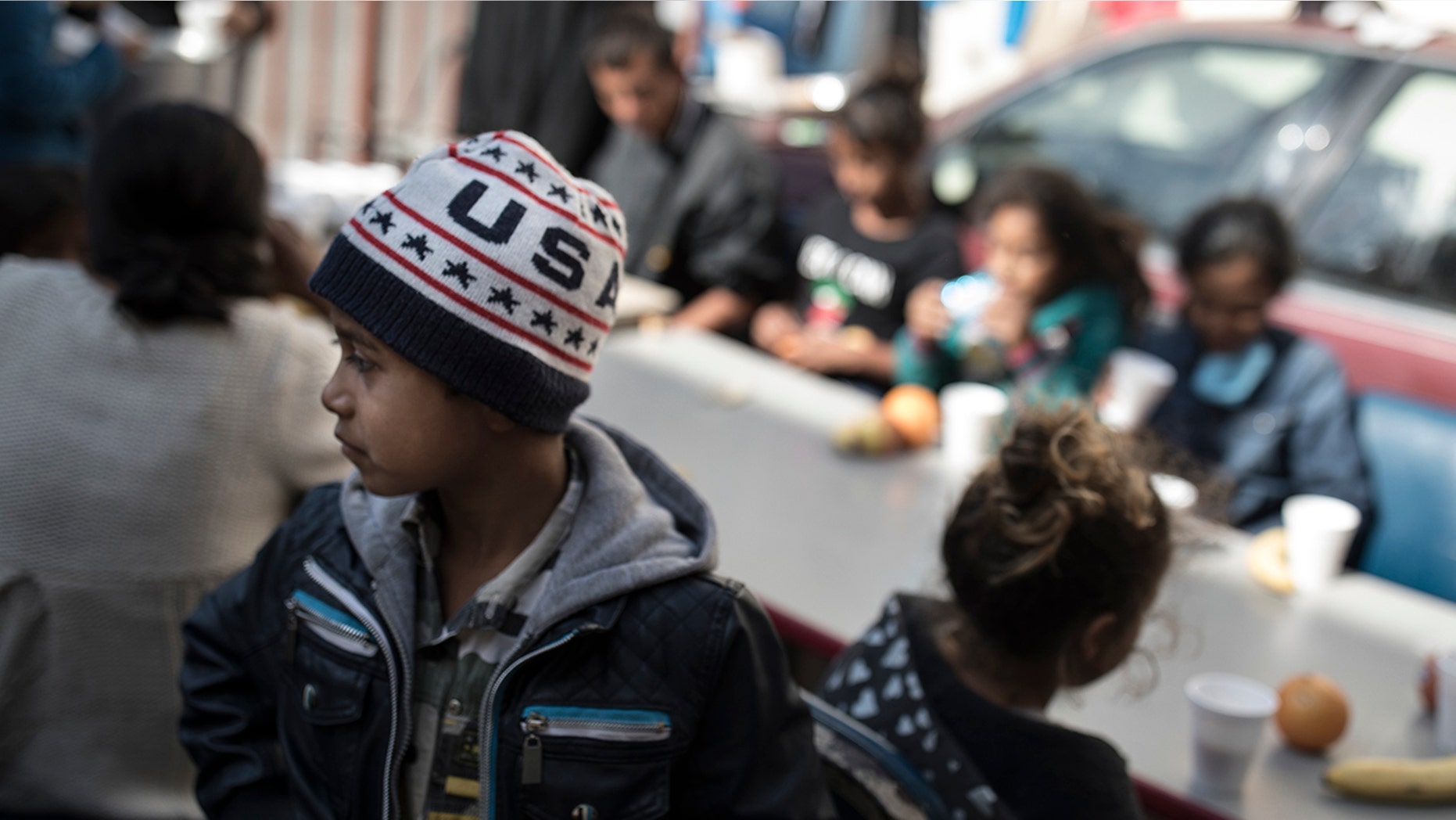 Migrant children have their breakfast at a shelter in Tijuana, Mexico on Saturday.