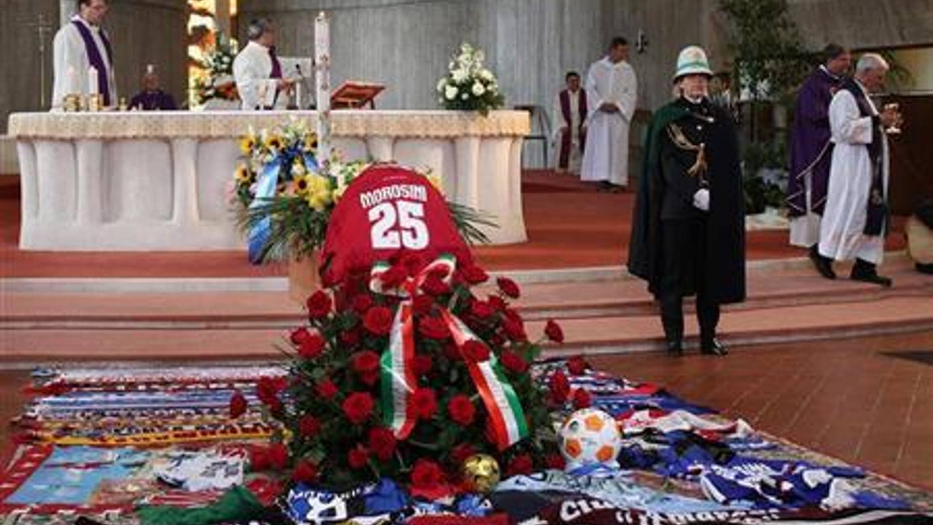 The coffin of Livorno's soccer player Piermario Morosini is seen during his funeral in Bergamo April 19, 2012. REUTERS/ANSA/Pool