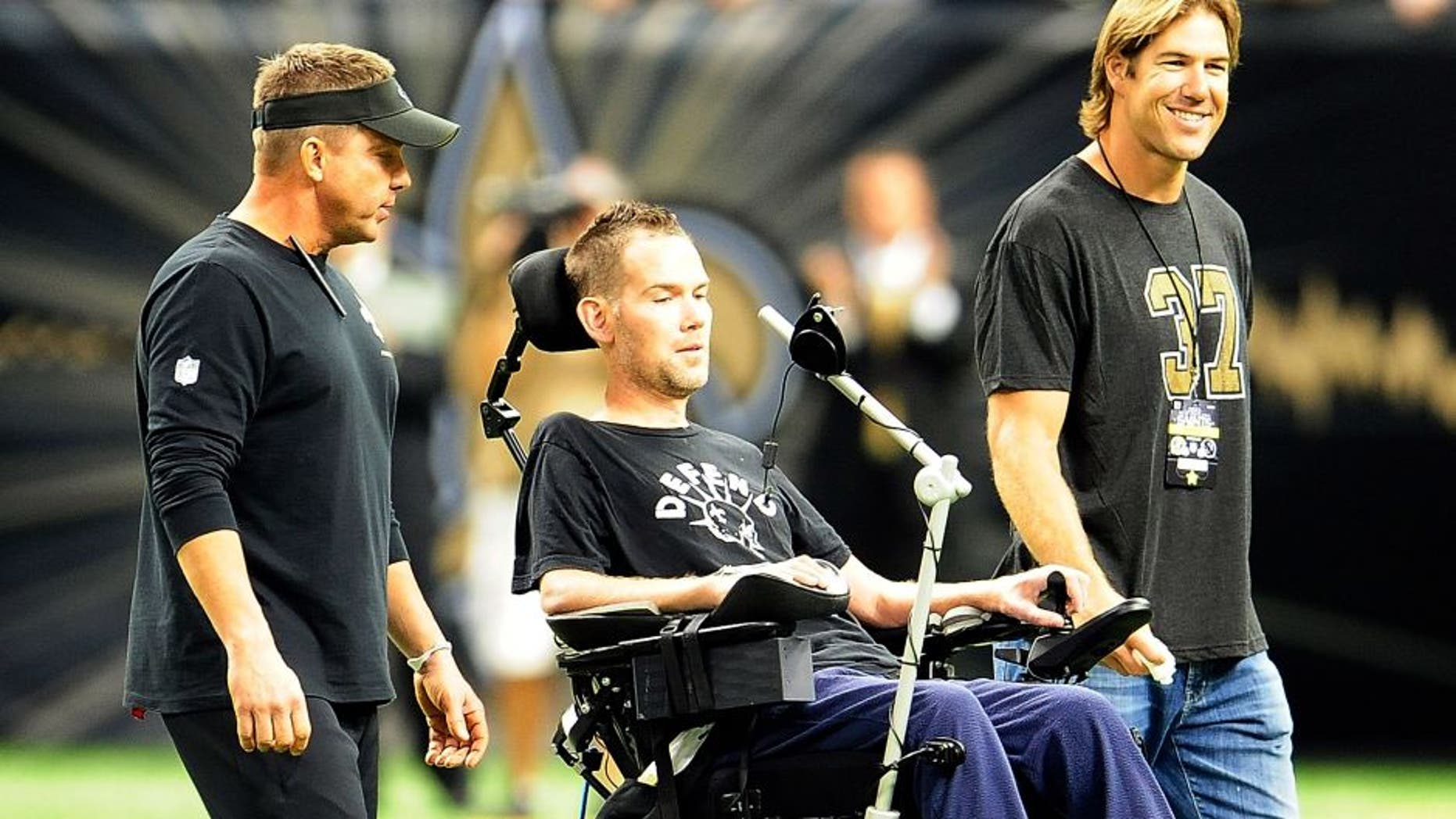 NEW ORLEANS, LA - SEPTEMBER 08: ( L to R ) Sean Payton, head coach of the New Orleans Saints, takes the field with former players Steve Gleason and Scott Fujita prior to a game against the Atlanta Falcons at the Mercedes-Benz Superdome on September 8, 2013 in New Orleans, Louisiana. The Saints defeated the Atlanta Falcons 23-17. (Photo by Stacy Revere/Getty Images)
