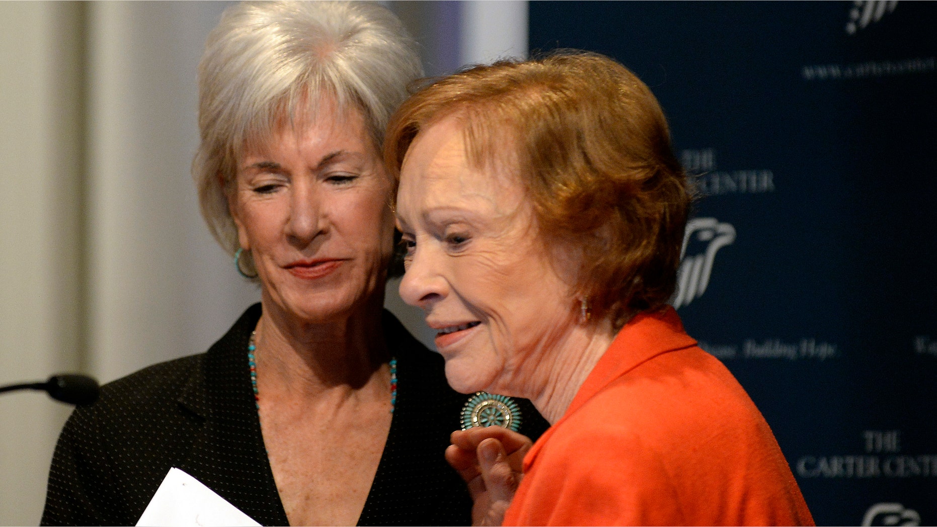 Former First Lady Rosalynn Carter, right, thanks Department of Health and Human Services Secretary Kathleen Sebelius, after Sebelius announced easier access to mental health care during the 29th annual mental health policy symposium at the Carter Center on Friday, Nov. 8, 2013, in Atlanta. (AP Photo/David Tulis)