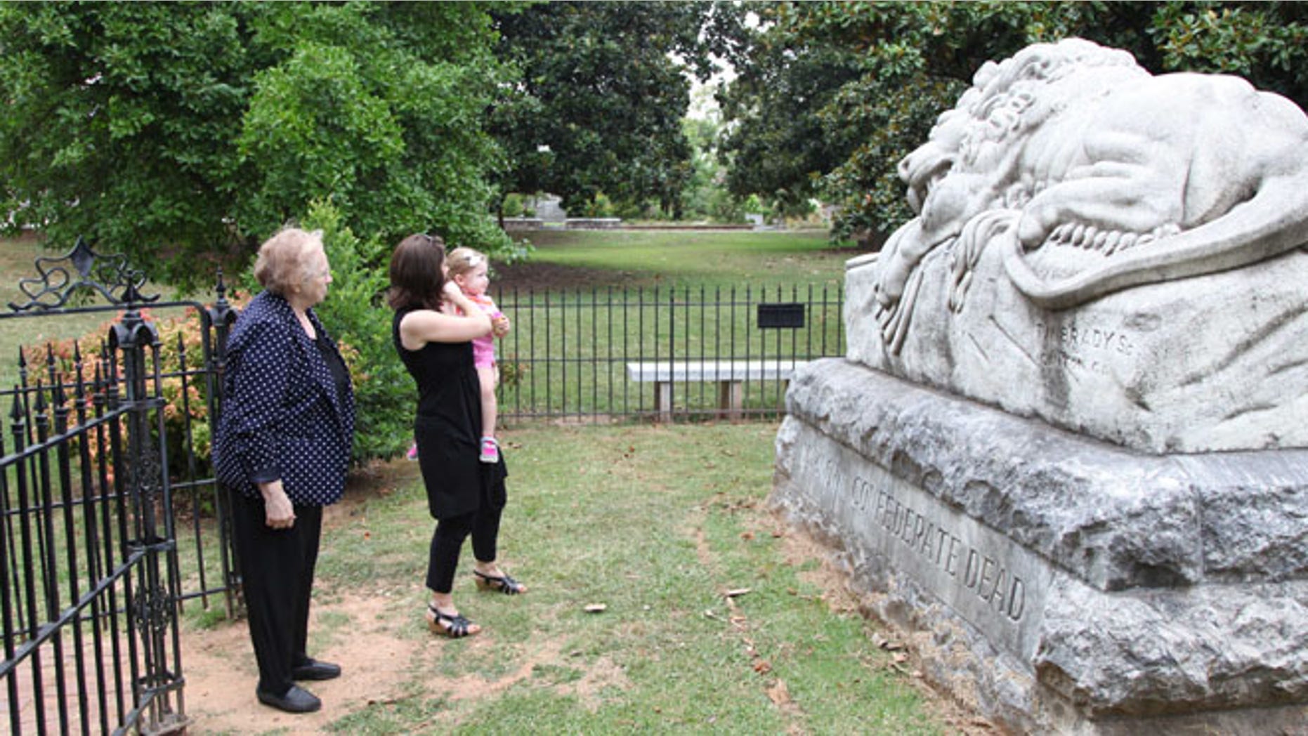 July 18, 2014: Janice Reed, her daughter Nancy Reed Morris, and her granddaughter Megan Morris, from left, visit the Confederate unknown soldier monument at Historic Oakland Cemetery while taking a Battle of Atlanta mobile app tour in Atlanta.