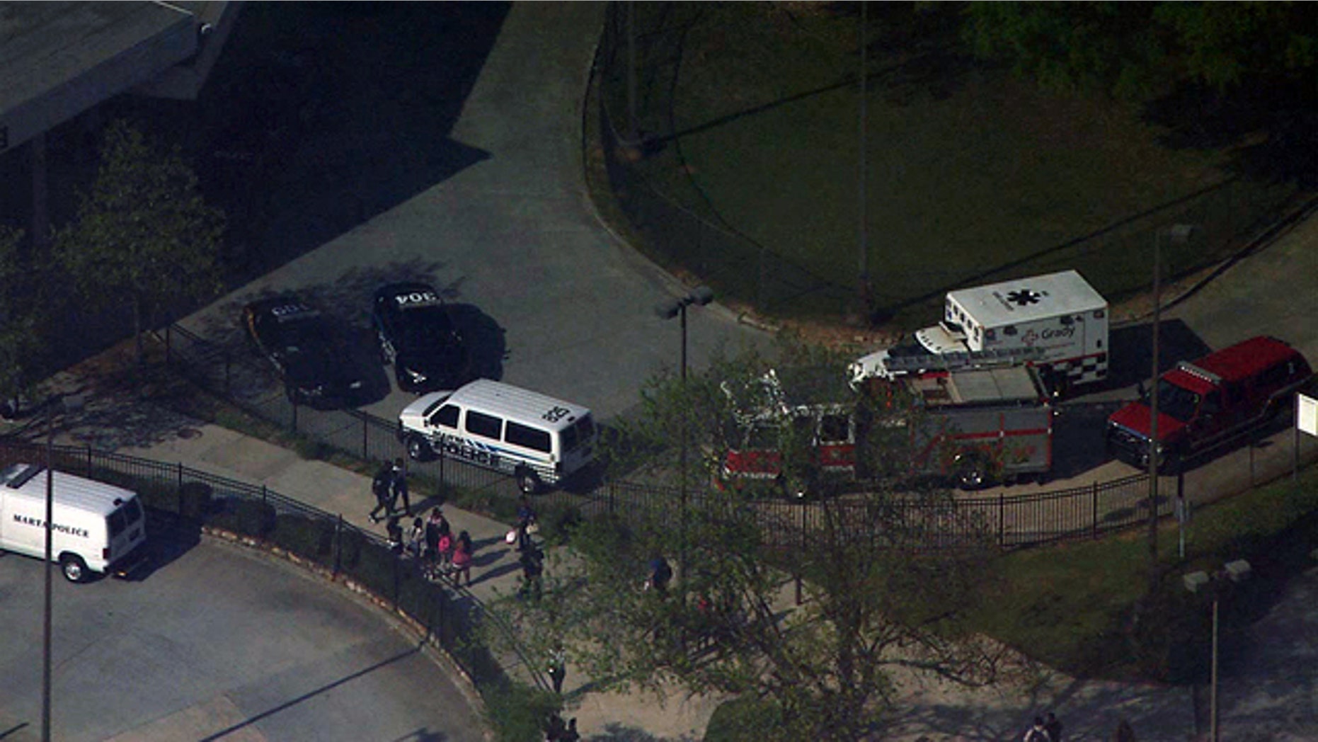 Emergency vehicles respond to the West Lake MARTA station after a shooting on board a train in Atlanta Thursday, April 13, 2017.