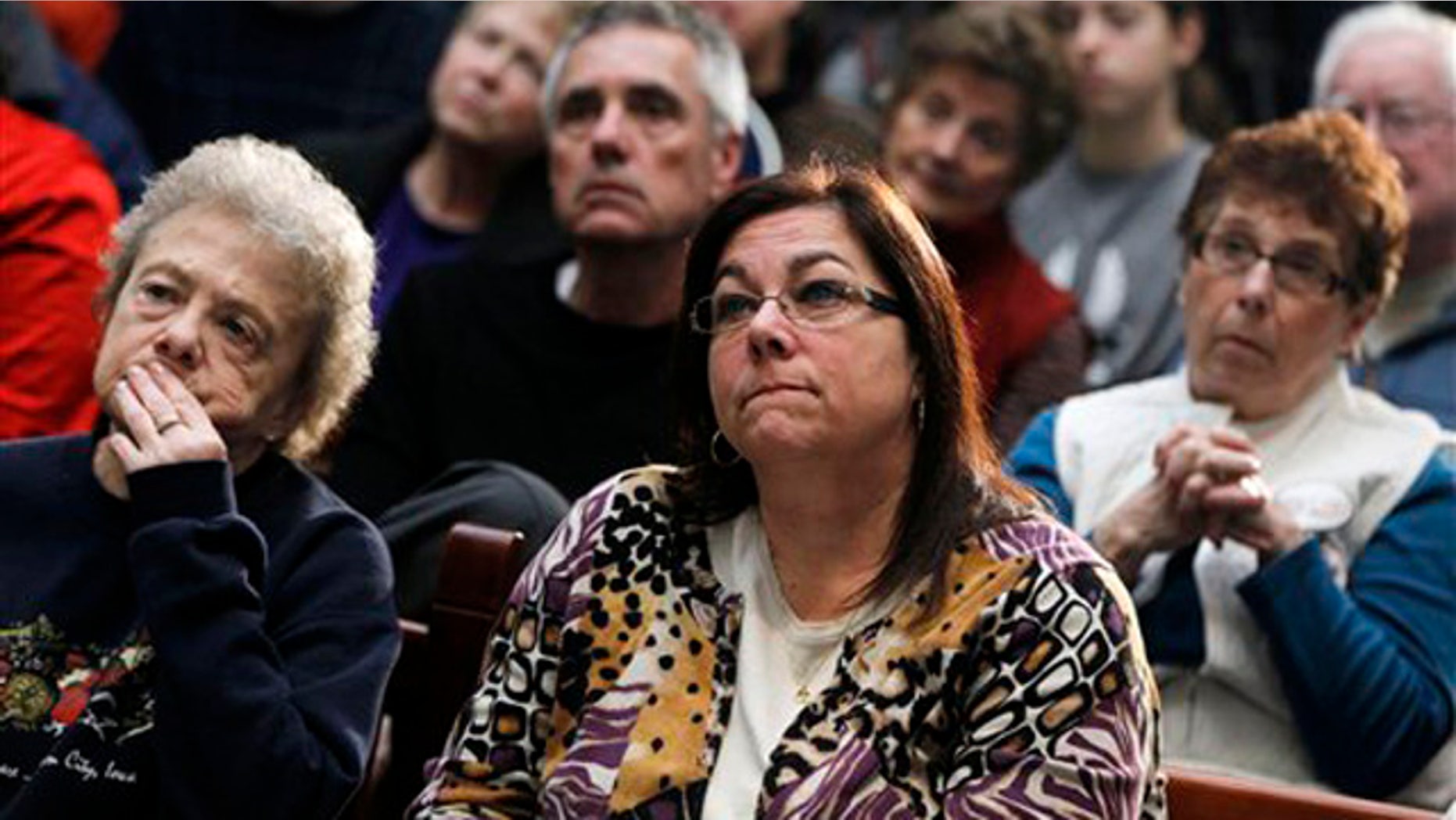 Dec. 28, 2011: Audience members listen as former House Speaker Newt Gingrich speaks during a campaign stop at the Southbridge Mall in Mason City, Iowa.