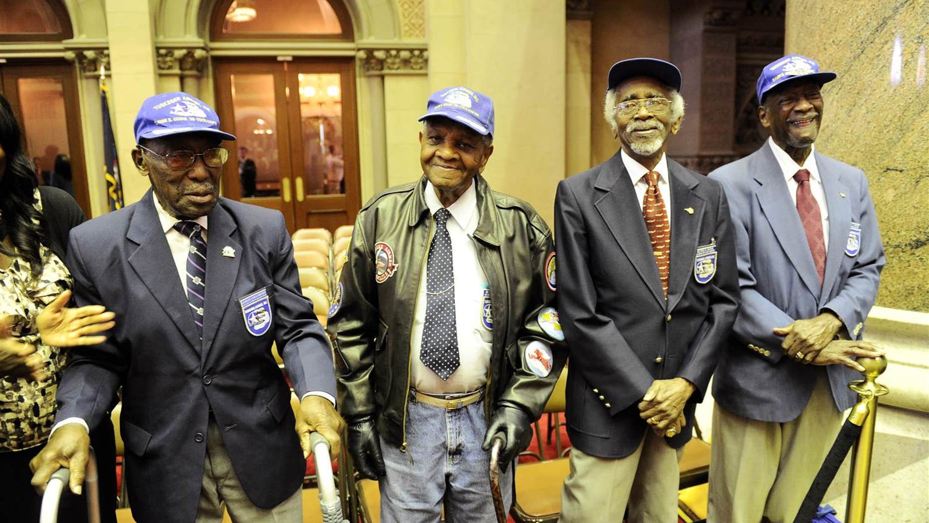 Audley Coulthurst, left, with Turkegee Airmen William Johnson, Wilfred R. DeFour and Herbert C. Thorpe, in June.