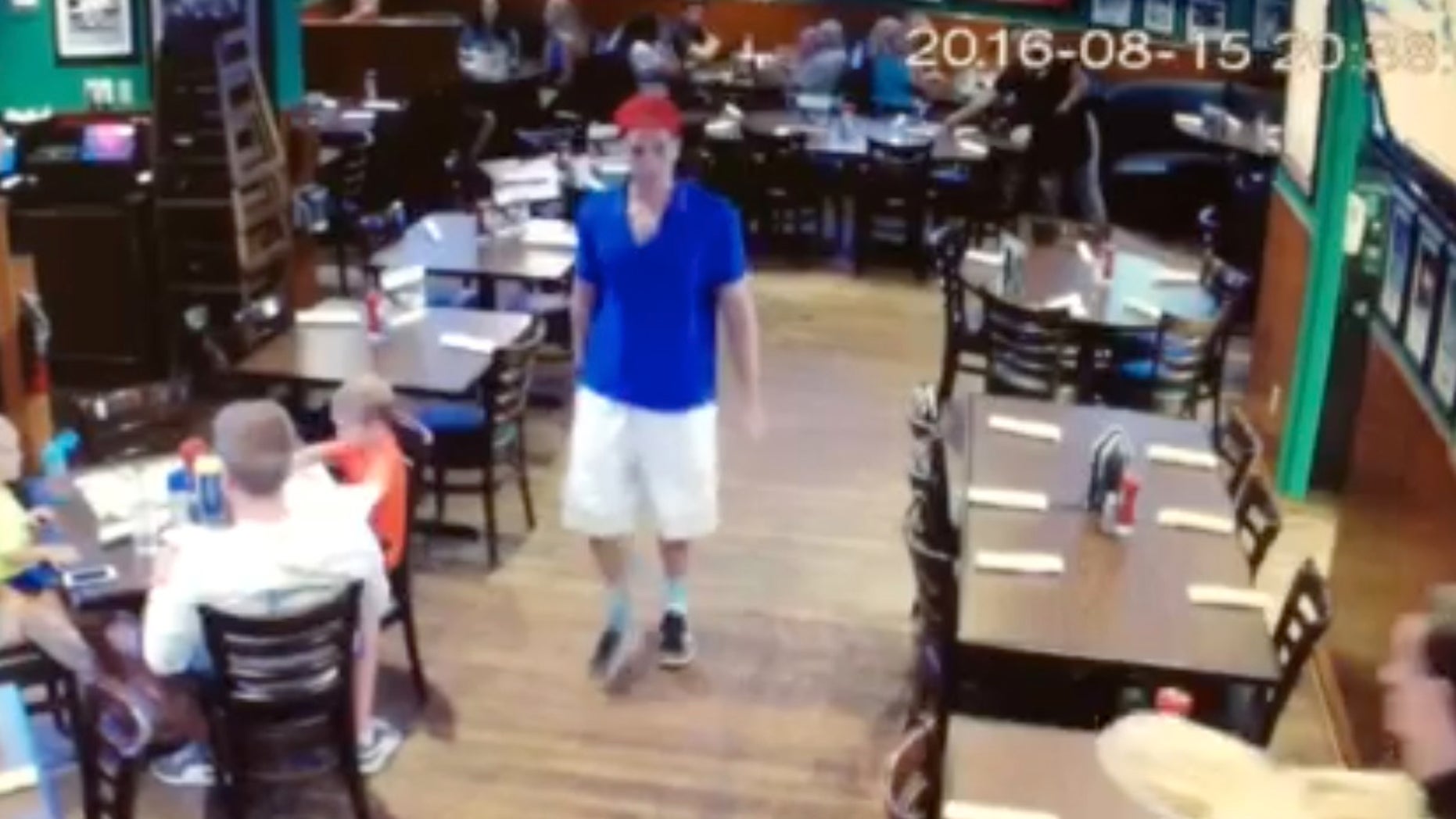 This image made from a video released Friday, Aug. 19, 2016, by Duffy's Sports Grill, shows Austin Harrouff leaving the restaurant in Jupiter, Fla. A Florida sheriff's said Friday that Harrouff caught trying to bite the face off a victim after stabbing the man and wife, will be charged with first-degree murder.