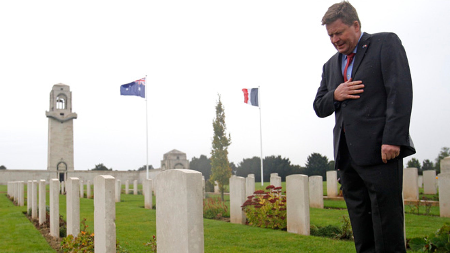 Oct 16, 2013: Australian Minister for Veterans Affairs, Michael Ronaldson looks at a tombstone of Australian soldiers in the Australian National Memorial of Villers-Bretonneux, northern France, where hundreds of Australian soldiers and other allied troops died to help save the French village in World War I.