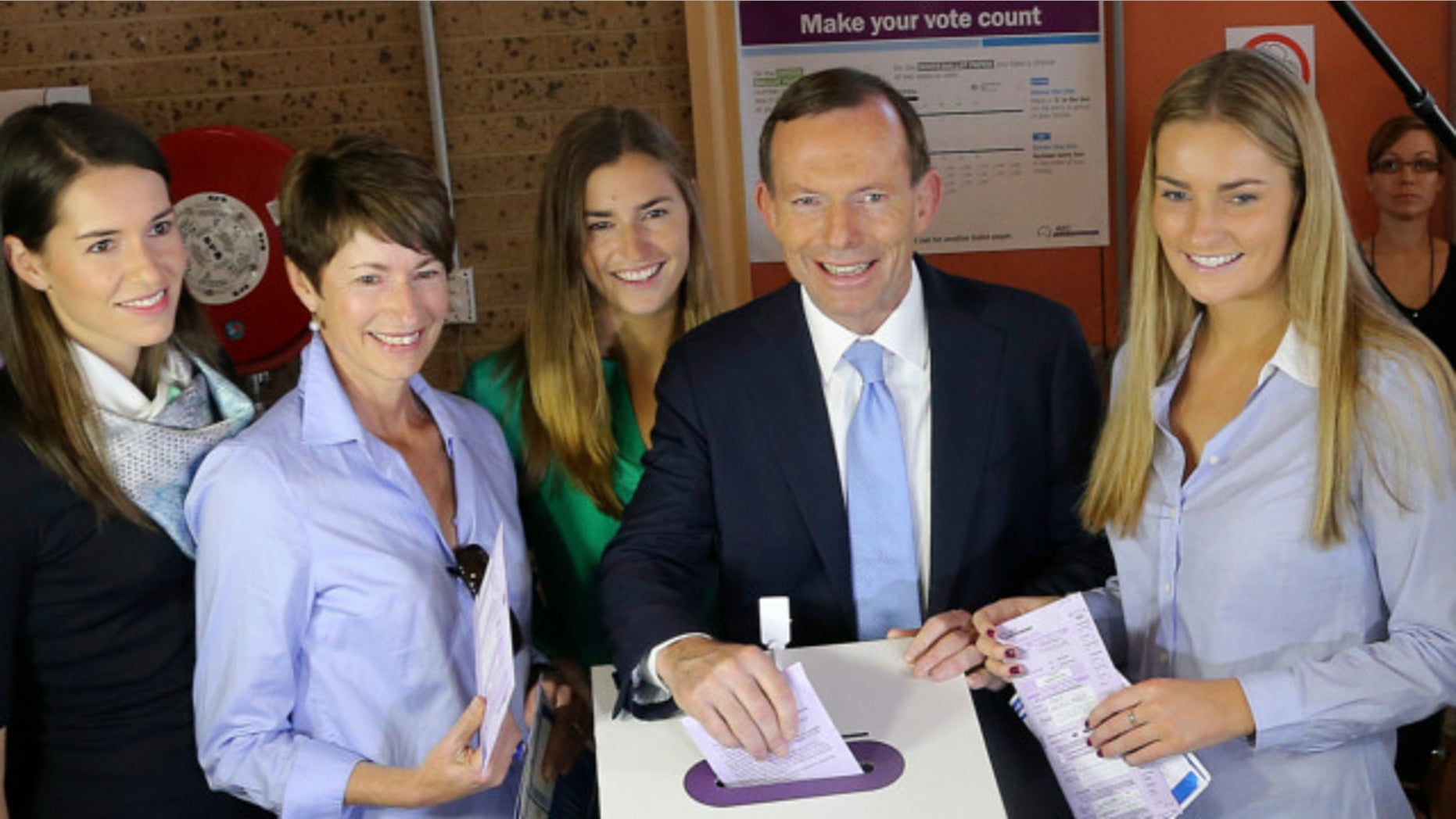 Sept. 7, 2013: Australia's opposition leader Tony Abbott, second right, and his family, from right, Bridget, Frances, wife Margaret and Louise cast their ballots at Freshwater Surf Club in Sydney, Australia.