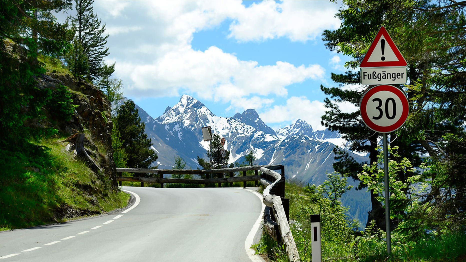 A tourist jumped into action after his bus operator passed out while driving on a road through the Alps.