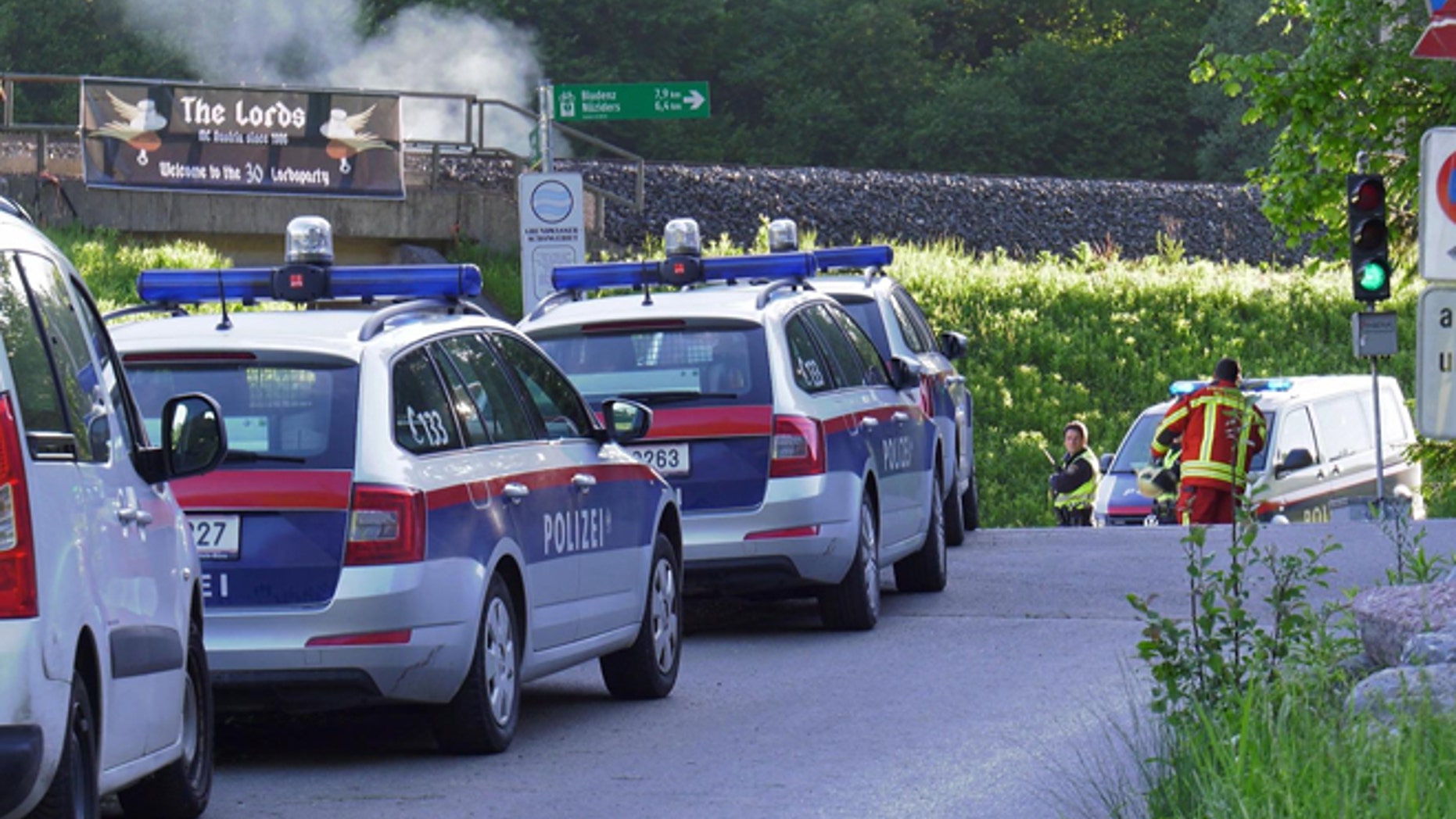 This image made from TV shows police attending the scene of a shooting near Nenzing, Austria, Sunday May 22, 2016. (AP)